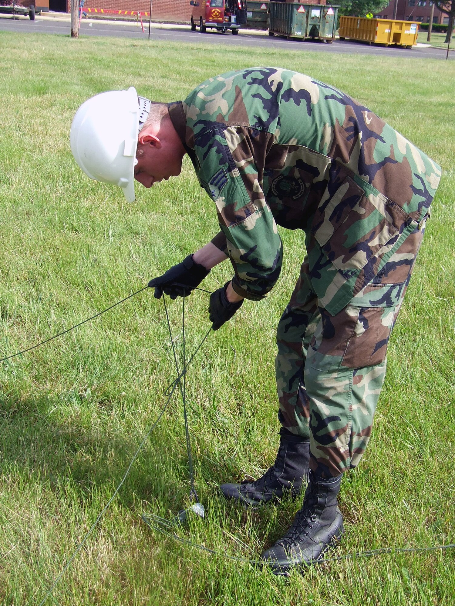 Senior Airman Brandon Smith, 573rd Global Support Squadron, Travis Air Force Base, Calif., prepares stabilization lines for an antenna pole as part of a class exercise for the Advanced Mobile Command and Control Communications Course at the U.S. Air Force Expeditionary Center June 12, 2007, at Fort Dix, N.J.  The course, taught by the USAF EC's Mobility Operations School, prepares communications Airmen assigned to contingency response units on advanced mobility communications.  (U.S. Air Force Photo/Tech. Sgt. Scott T. Sturkol)