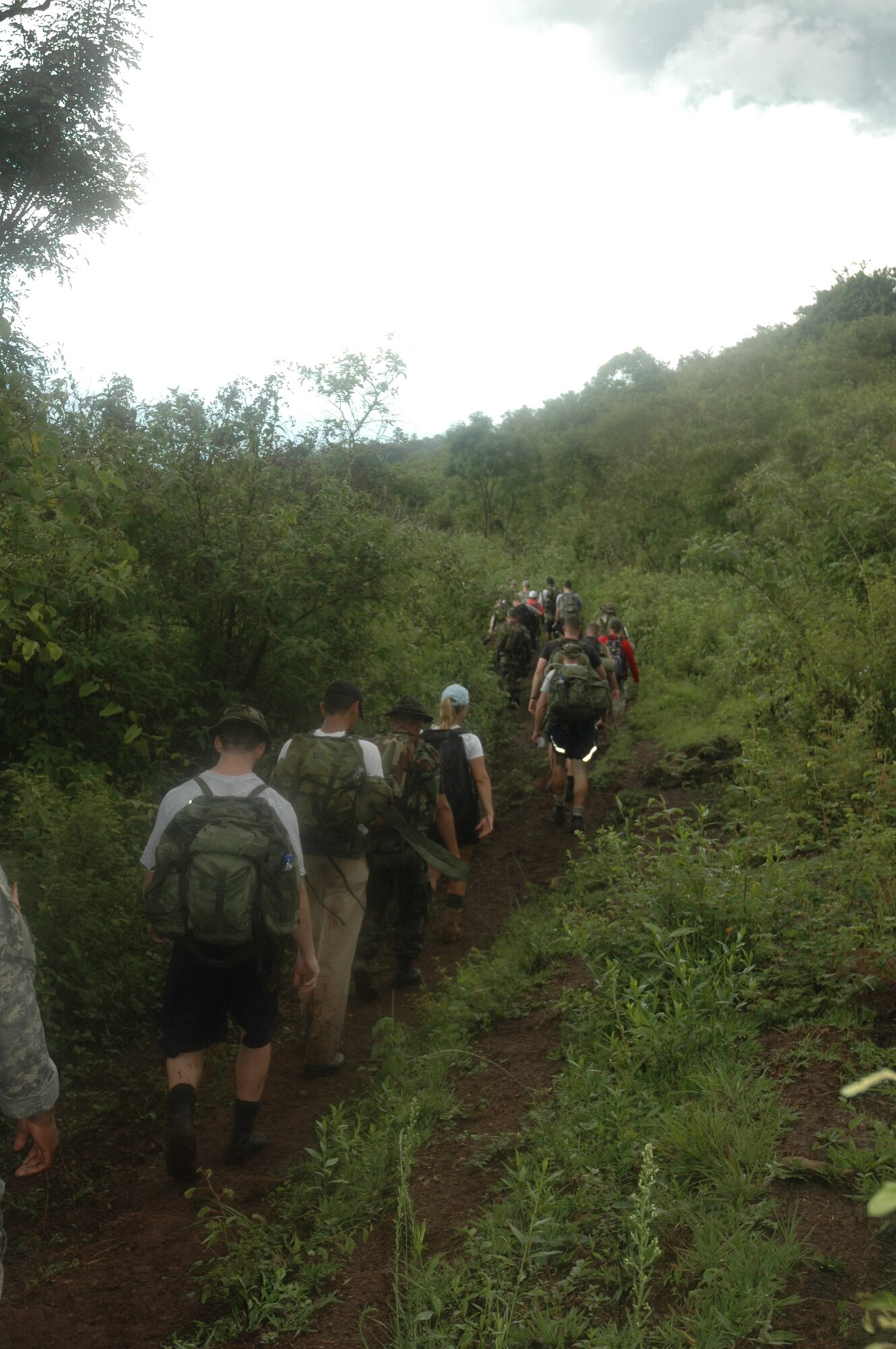 Participants of Iguana Challenge 2007, a two-day march from Tamara, Honduras to Soto Cano Air Base, make their way through the Honduran countryside. The march was a command directed volunteer march for members of Joint Task Force-Bravo and Honduran Military members. The 30-mile march took particpants over the mountains surrouding Soto Cano AB. U.S. Air Force photo by Senior Airman Shaun Emery.