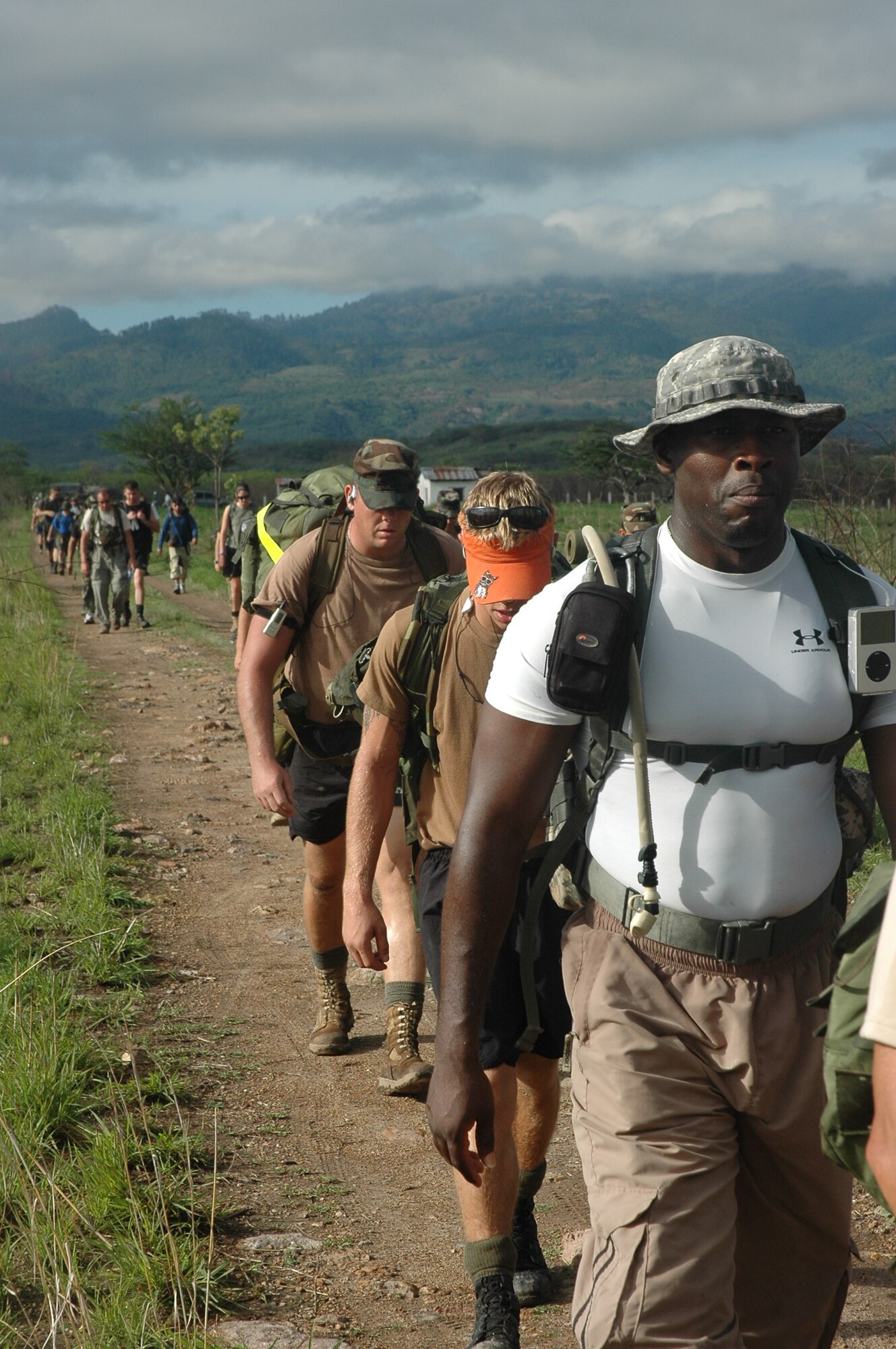 Army Staff Sgt. Shelley Croker leads a group of marchers across the comyagua valley on the second day of the two-day march from Tamara, Honduras. The march officially named "The Iguana Challenge" was a command directed volunteer march for members of Joint Task Force-Bravo and Honduran Military members. The 30-mile march took particpants over the mountains surrouding Soto Cano Air Base. 