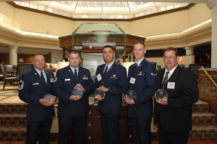 844th Communications Group members (left to right) Senior Master Sgt. Jesus Mireles, Tech Sgt. Keith Knotts, 2nd Lt. Nicholas Gomez, Airman First Class Gregory Benhaze and Mr. Michael Calkins pose for a photo following the award presentations June 8 at the Sheraton at Tysons Corner, Va. (U.S. Air Force photo by Airman 1st Class Timothy Chacon)