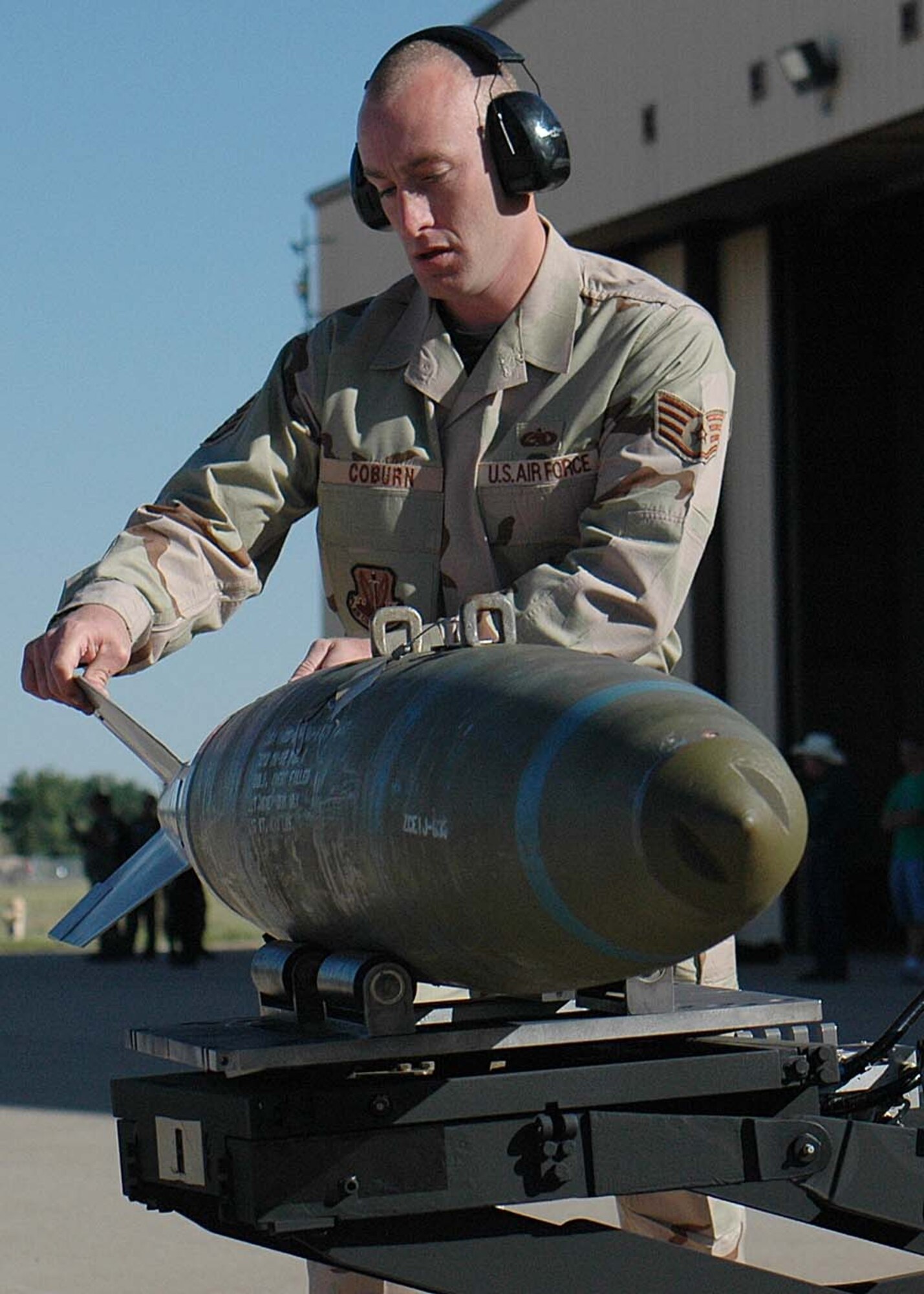Staff Sgt. William Coburn, 49th Aircraft Maintenance Squadron, places a bomb onto the jammer, the bomb-lift truck, during the weapons load competition at Cannon Air Force Base, N.M. Twenty five Airmen traveled to Cannon for the Pioneer Air Festival where the team took first place with a weapons load competition and bomb drop demonstration. (U.S. Air Force photo/Airman 1st Class Heather Stanton)