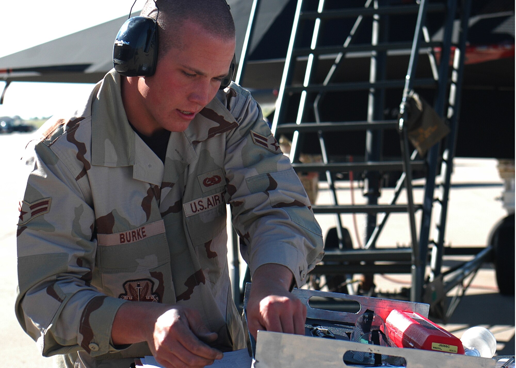 Airman 1st Class Riley Burke, 49th Aircraft Maintenance Squadron, does a final check during the weapons load competition at Cannon Air Force Base, N.M. Twenty five Airmen traveled to Cannon for the Pioneer Air Festival where the team took first place with a weapons load competition and bomb drop demonstration. (U.S. Air Force photo/Airman 1st Class Heather Stanton)