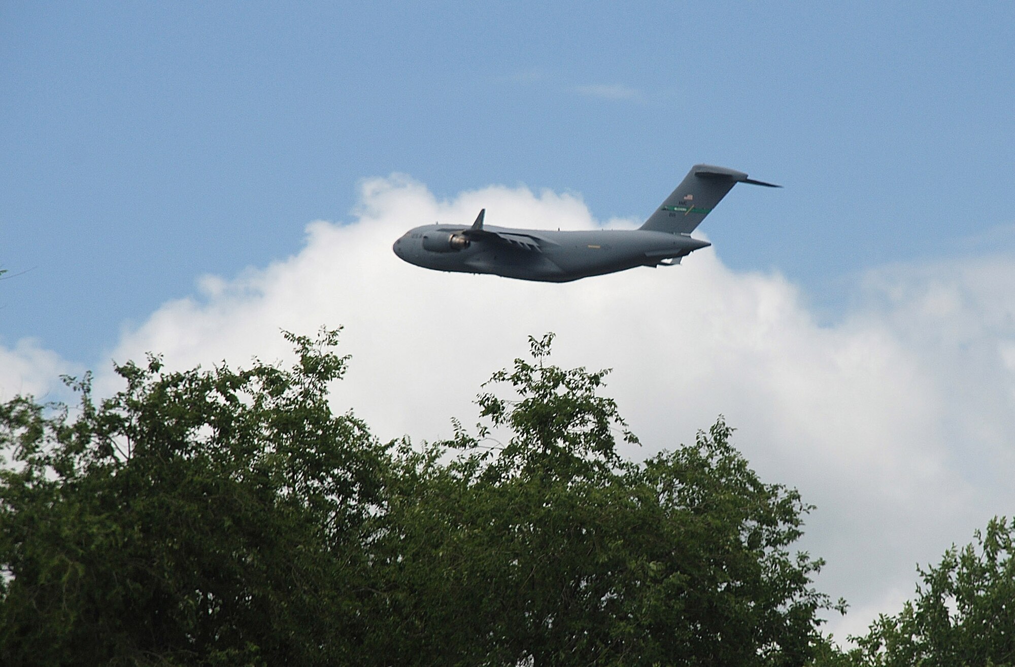 A U.S. Air Force C-17 Globemaster III, assigned to 817th Expeditionary Airlift Squadron Detachment 1 at Manas Air Base, Kyrgyz Republic, takes off from Manas Air Base for a mission.  Coalition C-17s and C-130s flew 141 airlift sorties delivering 1.2 million pounds of cargo June 11.  (Air Force photo/Capt. Stan Paregien)