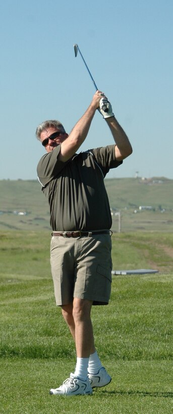 Tim Byrd tees off on the 6th hole of the Prairie Ridge Golf course during the two-person tournament June 9. Byrd and his teammate, Suntara Nop won the overall tournament. The two-person tournament used the Ryder Cup format. All teams played six holes as a scramble, six holes using best ball and six holes using alternate shots. “The tournament was a great success,” said Jerry Gullion, Prairie Ridge Golf course assistant manager, “We had a super time and will continue to do this annually.” (U.S. Air Force photo/Tech. Sgt. Todd Wivell)
