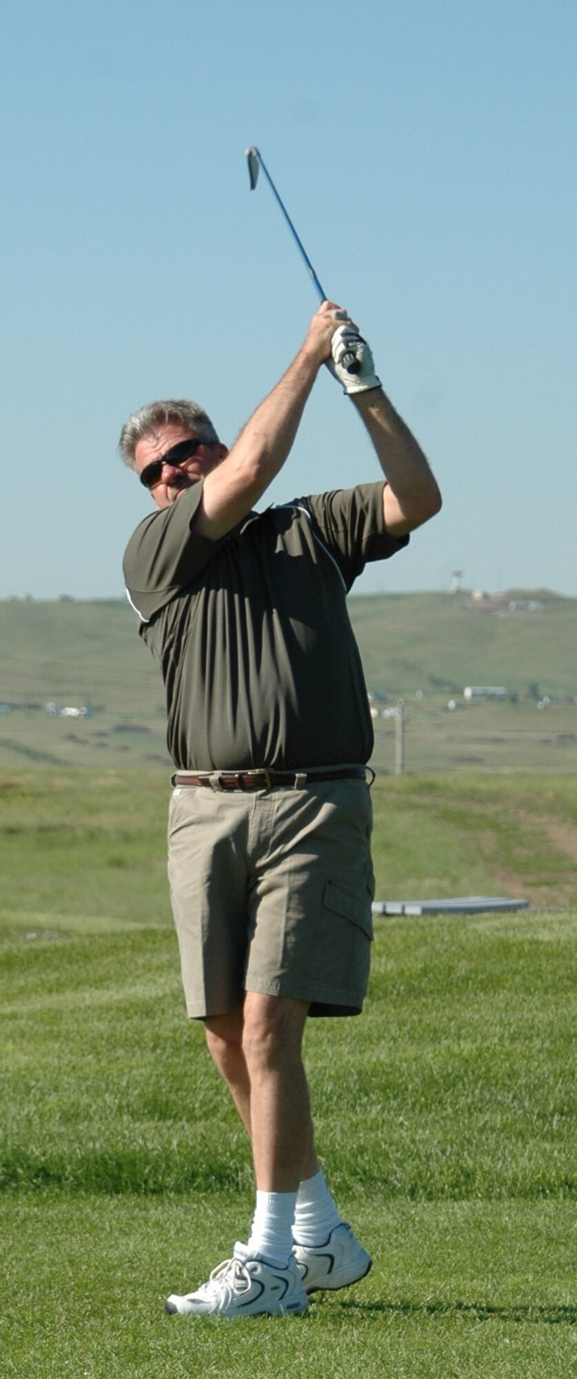 Tim Byrd tees off on the 6th hole of the Prairie Ridge Golf course during the two-person tournament June 9. Byrd and his teammate, Suntara Nop won the overall tournament. The two-person tournament used the Ryder Cup format. All teams played six holes as a scramble, six holes using best ball and six holes using alternate shots. “The tournament was a great success,” said Jerry Gullion, Prairie Ridge Golf course assistant manager, “We had a super time and will continue to do this annually.” (U.S. Air Force photo/Tech. Sgt. Todd Wivell)