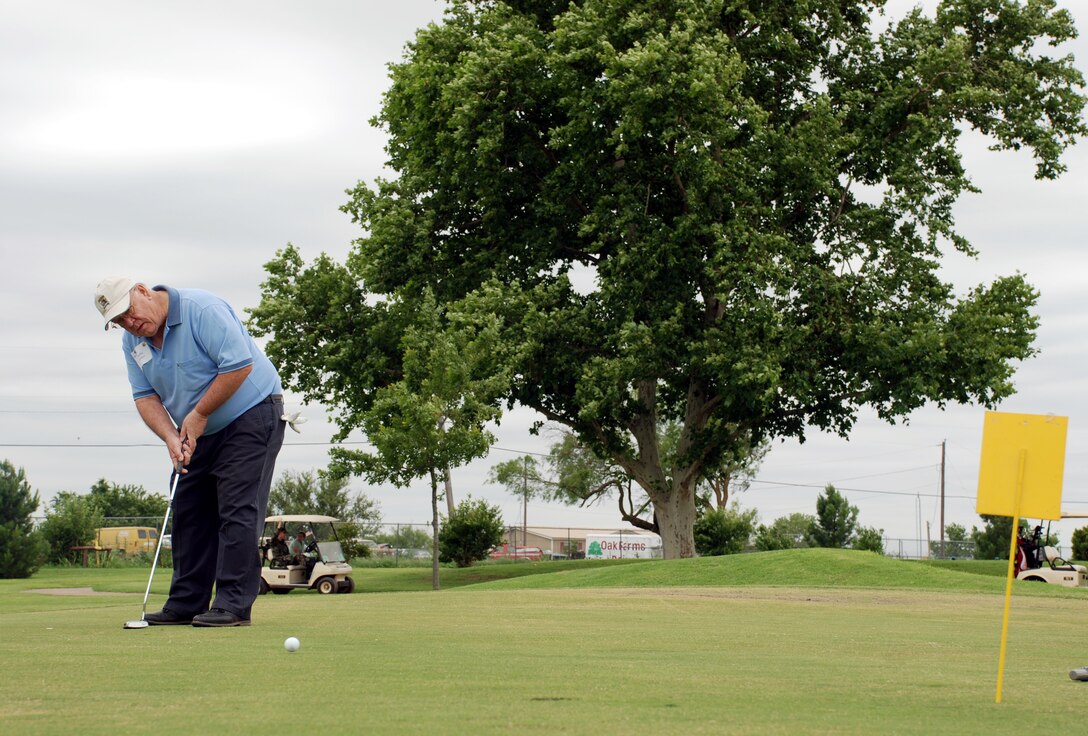 Jodie Walker, a contractor with Lier Siegler Industries, makes a putt during the 37th Annual Board of Commerce and Industry/Sheppard Air Force Base Golf Tournament June 8 at Wind Creek Golf Course. (U.S. Air Force photo/Airman 1st Class Jacob Corbin)