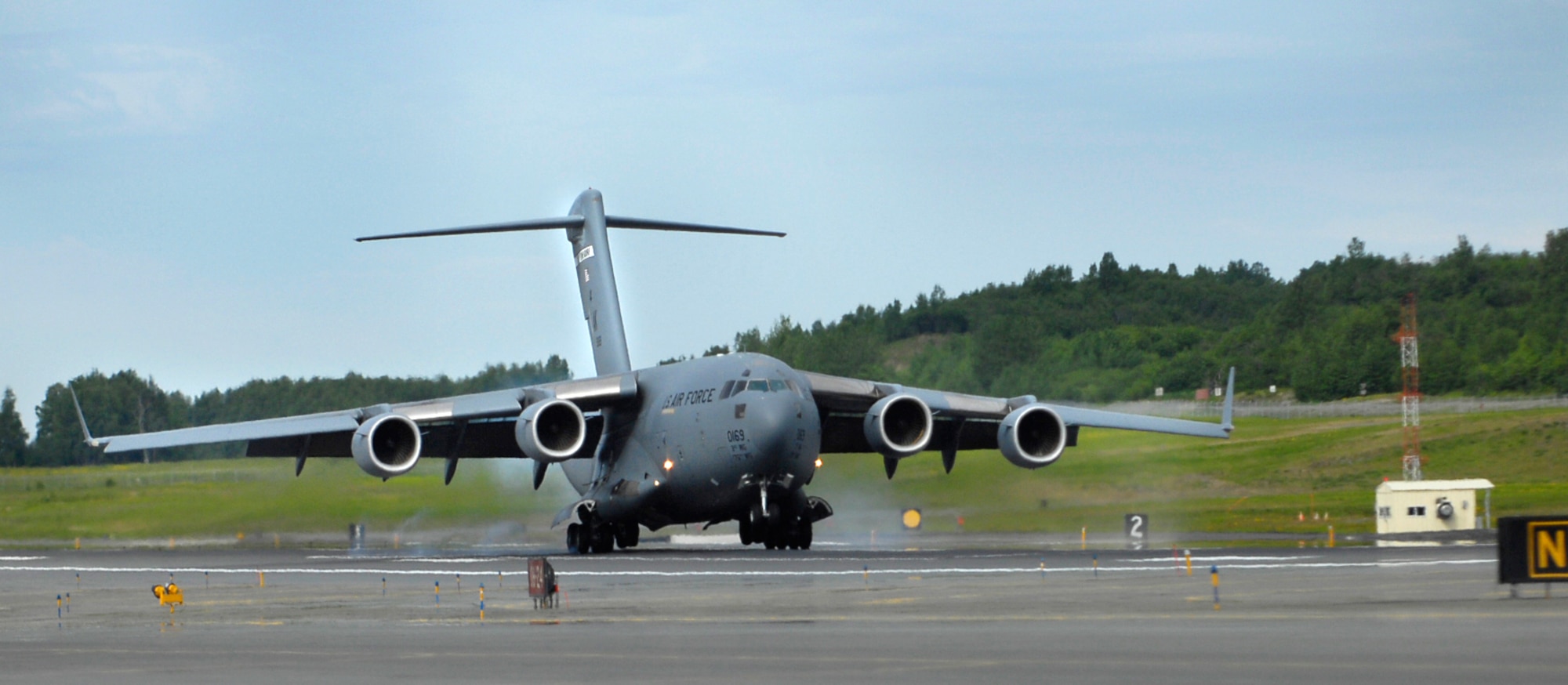 The C-17 Globemaster III "Spirit of Denali" touches down for the first time June 11 at its new home at Elmendorf Air Force Base, Alaska. "Spirit of Denali" is the first C-17 of eight to arrive at Elmendorf AFB. (U.S. Air Force photo/Airman 1st Class Tinese Treadwell)