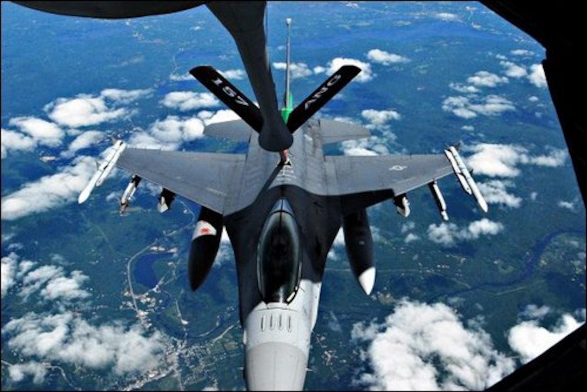 John Huff/Staff photographer Major Brian Waters of the Vermont based 158th Fighter Wing positions his F-16 Fighting Falcon for mid-air refueling by one of the 157th Air Refueling Wingís KC-135 tankers Wednesday over New Hampshire.