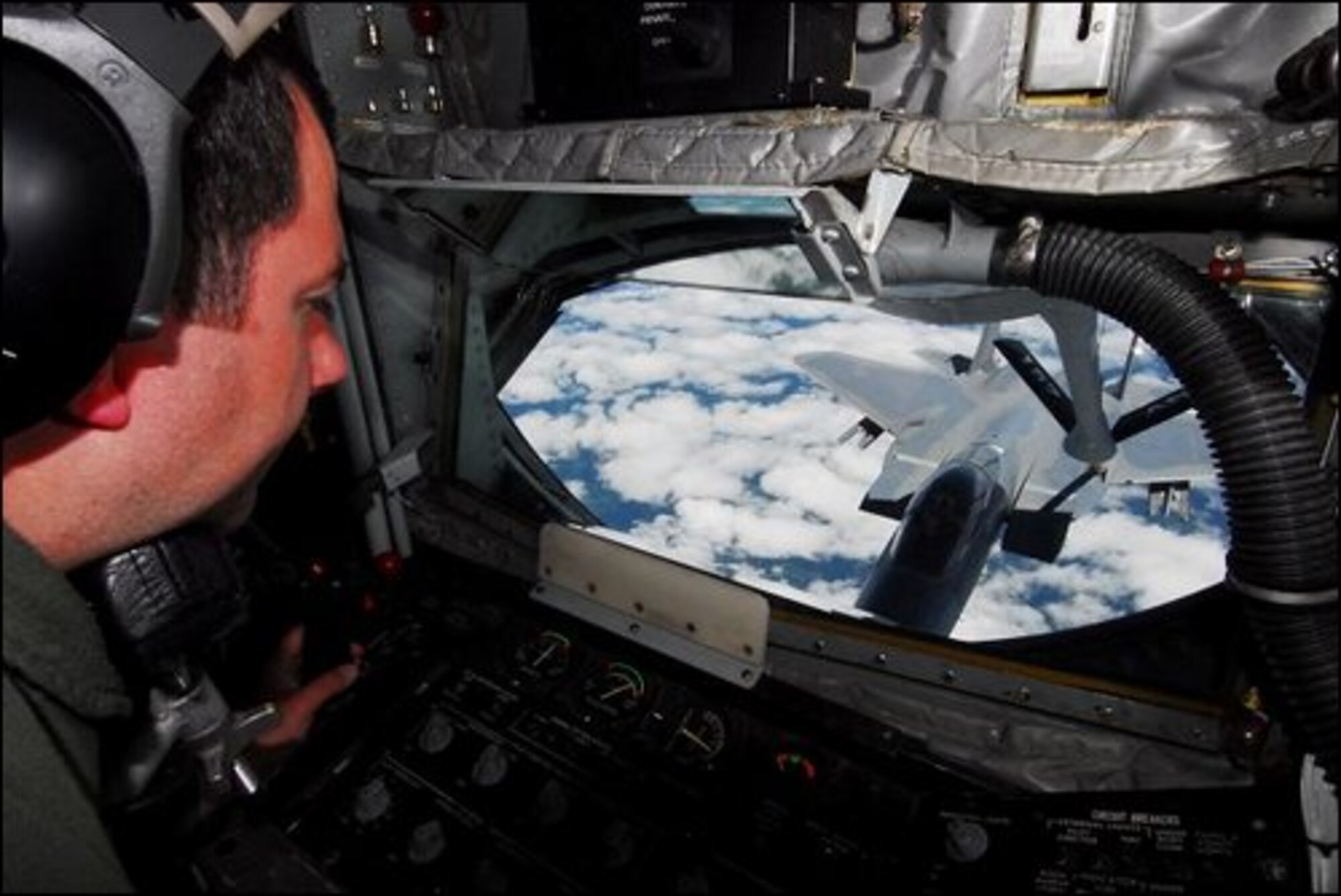 John Huff/Staff photographer Boom Operator Sgt. Mike Girouard controls the boom of a New Hampshire Air National Guard, 157th Air Refueling Wing KC-135 as he refuels an F-15 Eagle out of Ottis Air Force Base over the skies of New Hampshire Wednesday afternoon. 