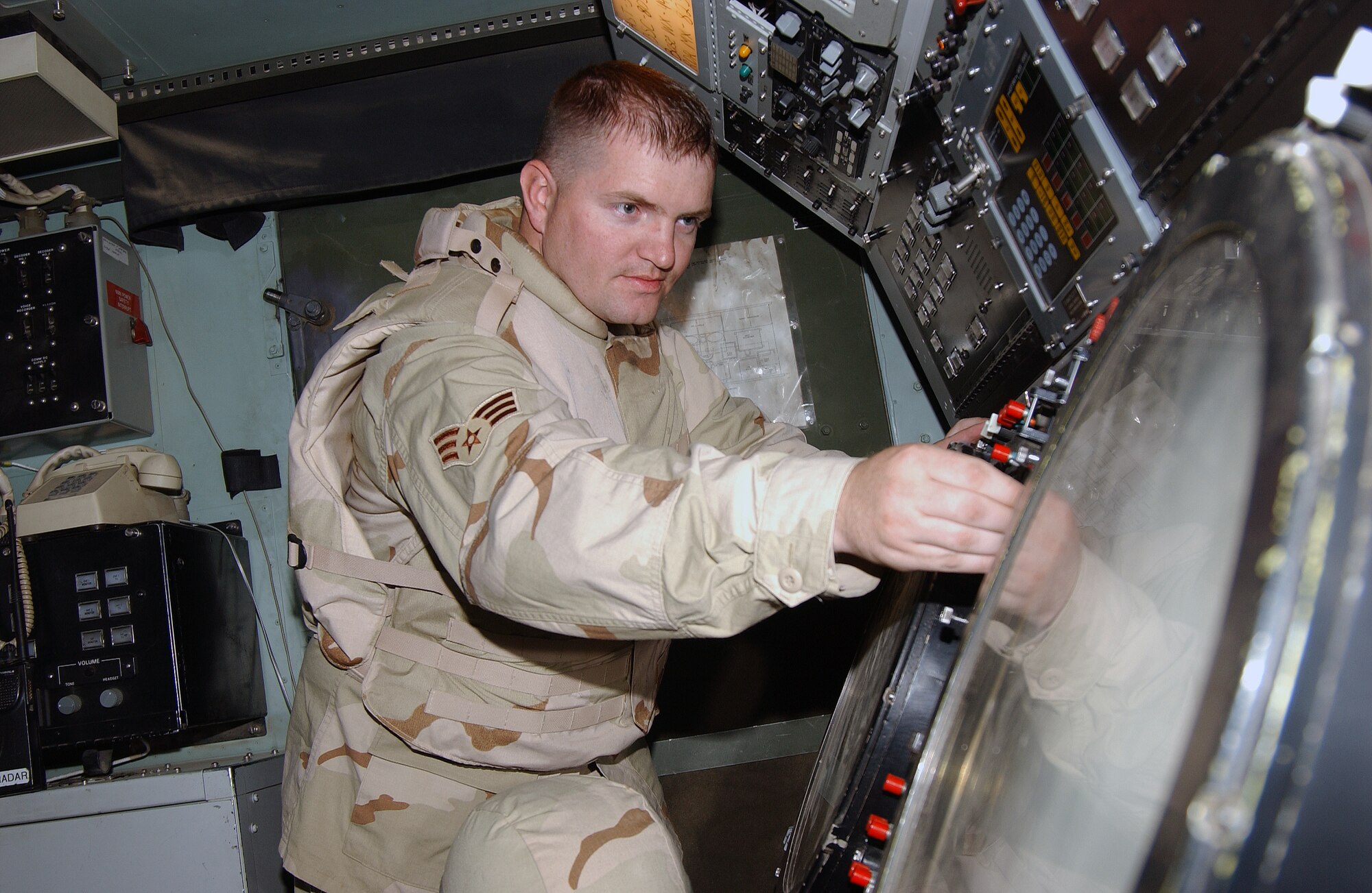 Senior Airman Manchester performs preventative maintenance on a UPA-59 decoder during a daily inspection of one of the TPS-75 air control and warning radar at Balad Air Base, Iraq. Airman Manchester, a 727th Expeditionary Air Control Squadron radar maintenance technician, is deployed from Hill AFB, Utah. (U.S. Air Force photo by Senior Airman Olufemi A. Owolabi)