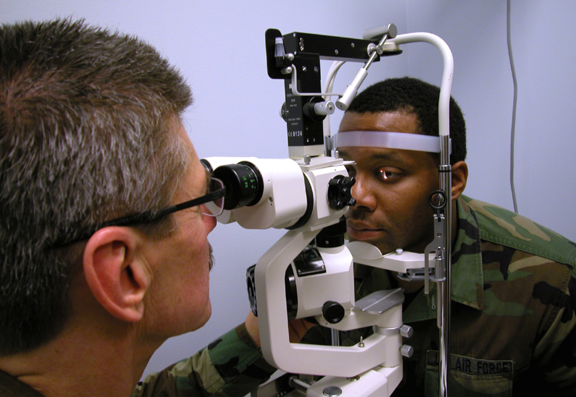 GRISSOM AIR RESERVE BASE, Ind., -- Lt. Col. (Dr.) Ricardo Salvat, optometrist, performs a slit-lamp exam on Staff Sgt. Jason Geiger, 434th Aerospace Medicine Squadron.  The exam is performed on the cornea to detect foreign objects and abrasions.  The colonel notes this type of corneal damage can result from fireworks accidents. Doctor Salvat warns that everyone must stay cognizant of the need for eye protection and that eye safety is no accident. (U.S. Air Force photo/Senior Airman Chris Bolen)