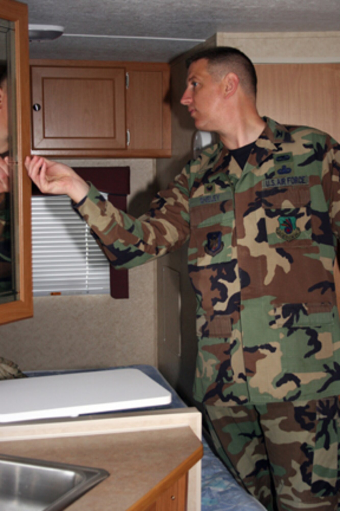 GRISSOM AIR RESERVE BASE, Ind., -- Col. Stan Sheley, the 434th Maintenance Group commander, examines the interior of one of the campers available for rental at the 434th Services Flight at the Outdoor Recreational Rental office at Grissom Air Reserve Base. The 434th Services flight has a variety of well maintained equipment available for rental. Rentals range from recreational to utilitarian. (U.S. Air Force photo/Senior Airman Omar Delacruz)