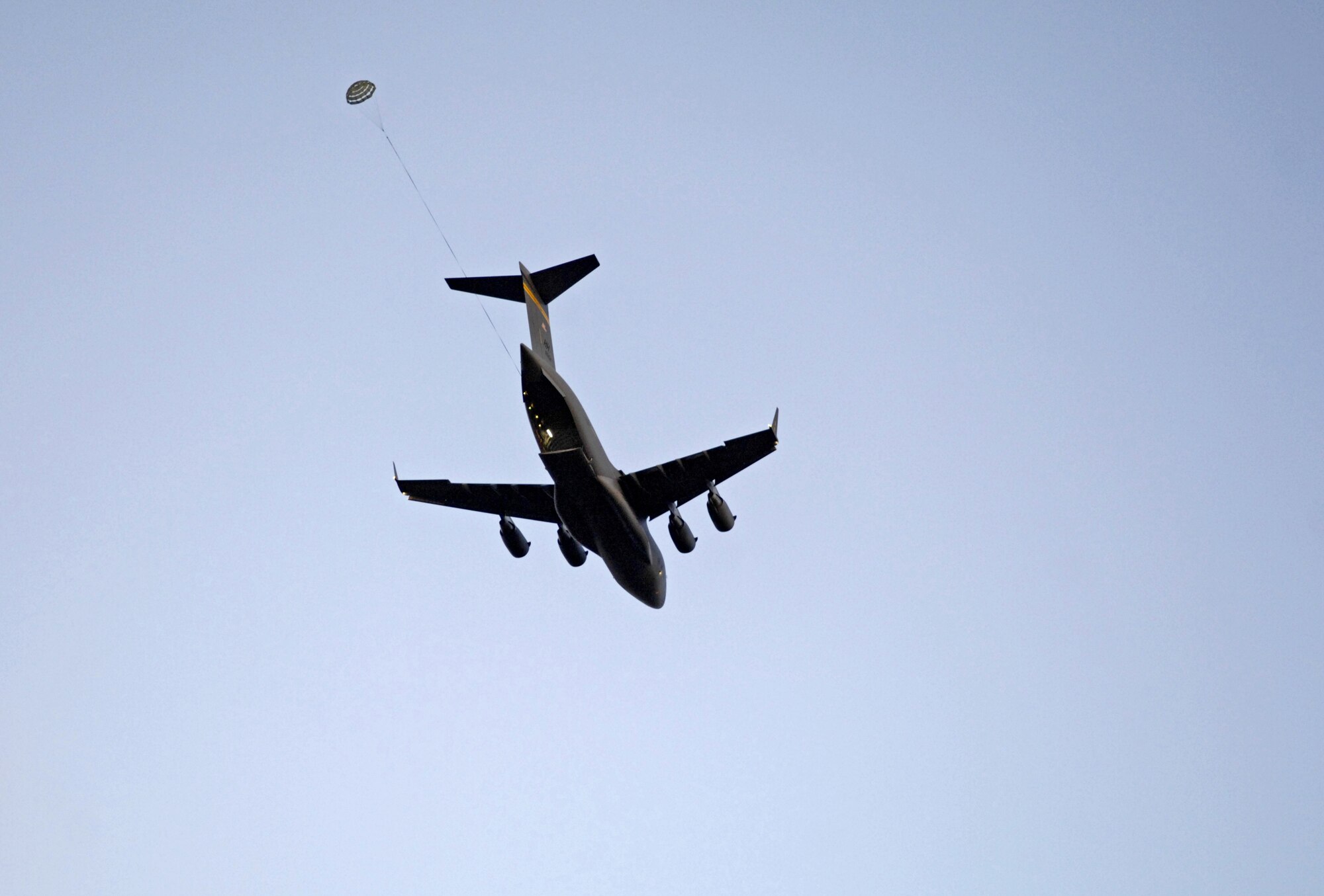 A C-17 Globemaster III prepares to drop a practice bundle at the Kahuku Training Range in Hawaii Monday. The C-17’s, from the 535th Airlift Squadron, Hickam Air Force Base, Hawaii are conducting their quarterly airdrop qualifications. (U.S. Air Force photo/ Tech. Sgt. Shane A. Cuomo)