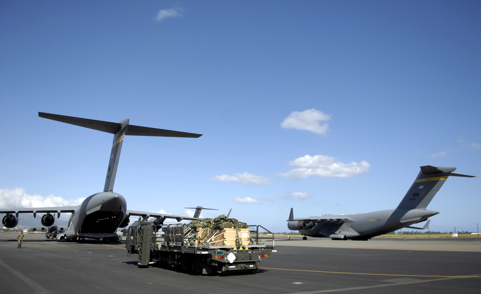 HICKAM AIR FORCE BASE, Hawaii -- Practice bundles sit on a K-Loader waiting to be loaded on C-17 Globemaster III here Monday.  The C-17’s are practicing their quarterly airdrop qualifications. The C-17’s are from the 535th Airlift Squadron. (U.S. Air Force photo/ Tech. Sgt. Shane A. Cuomo)