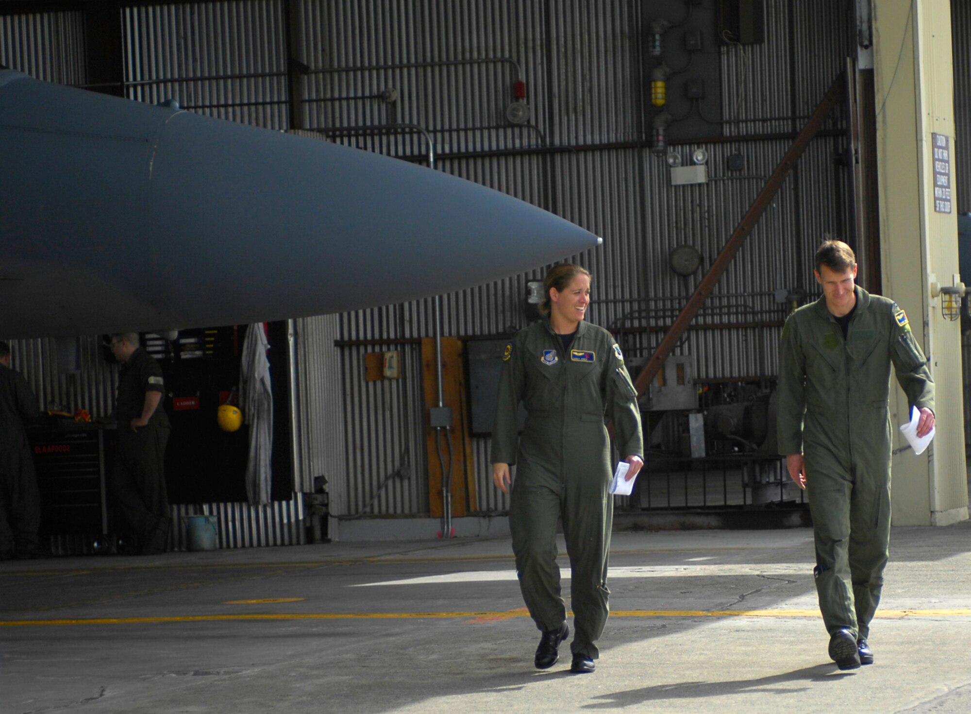 ELMENDORF AIR FORCE BASE, Alaska -- Maj. Carey Jones walks with her husband Capt. Blaine Jones following their flight June 6. The couple became the first husband and wife to fly an alert practice scramble together. Both are members of Elmendorf's 19th Fighter Squadron. (U.S. Air Force photo by Airman 1st Class Tinese Treadwell)
