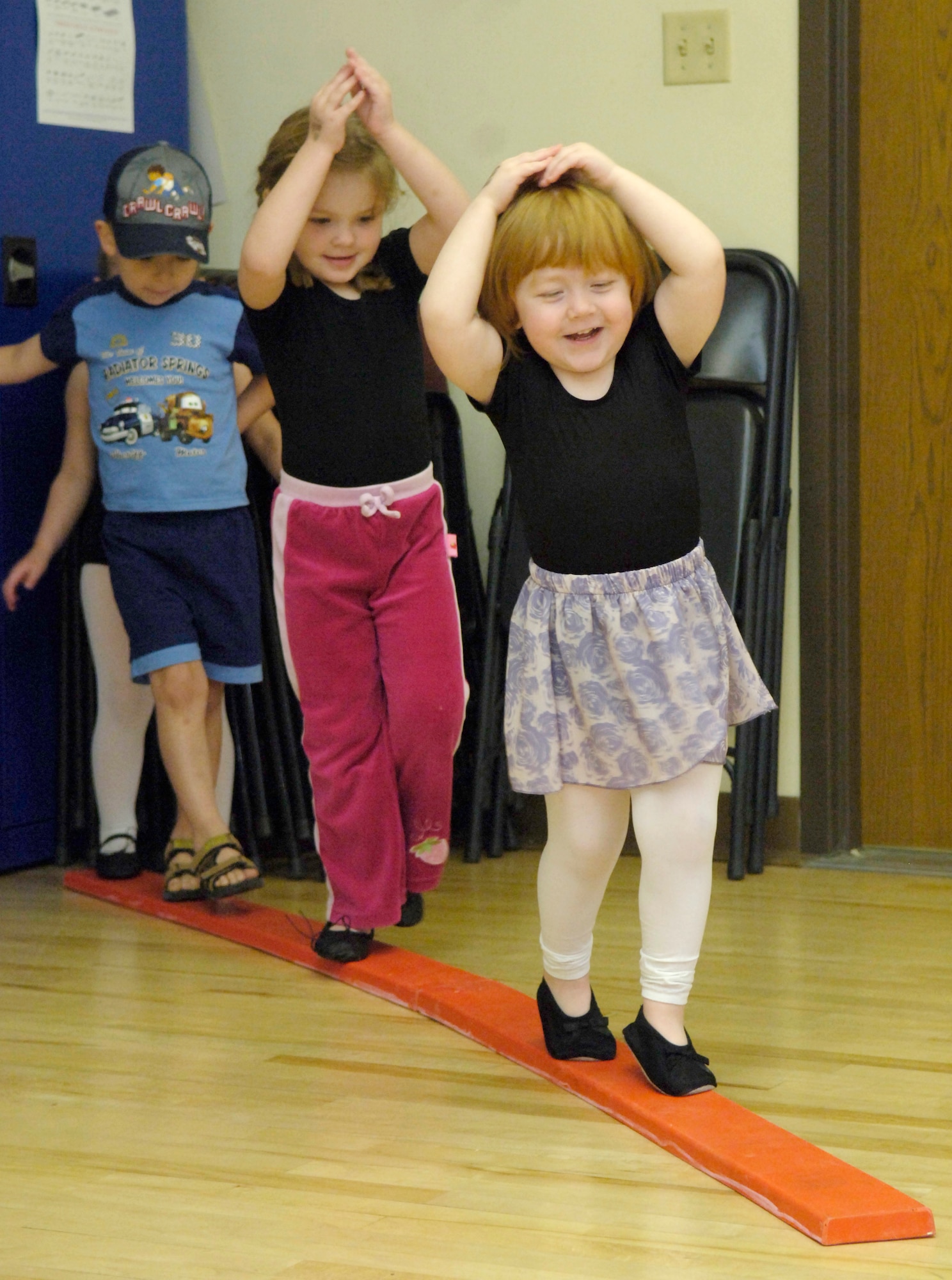 MOUNTAIN HOME AIR FORCE BASE, Idaho -- Preschoolers wait in line to practice new dance moves during a creative movement and dance class at the youth center here June 13. Classes offered are geared for newborns to children up to age 10 and help develop creativity, coordination and confidence. (U.S. Air Force photo/Airman 1st Class Ryan Crane)