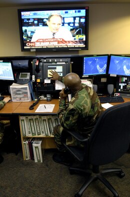 HICKAM AIR FORCE BASE, Hawaii -- Staff Sgt. Lynn Brown works at his control console inside the command post here Friday. Sergeant Brown is an emergency actions controller from the 15th Airlift Wing. (U.S. Air Force photo/ Tech. Sgt. Shane A. Cuomo) 