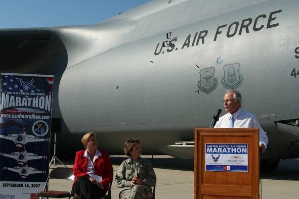 Leadership from both the Air Force and Wright State University gather at a press conference June 13 to discuss their new USAF Marathon partnership, and other details of the September race. On the flightline of the 445th Airlift Wing in front of a massive C-5 Galaxy -- the featured aircraft of the 11th annual race --  are Lt. Gen. Terry Gabreski, vice commander of Air Force Materiel Command, Molly Louden, director of the USAF Marathon, and David R. Hopkins, president of Wright State University, who all took turns speaking to nearly two dozen media members. (Air Force photo by Kathleen A.K. Lopez)
