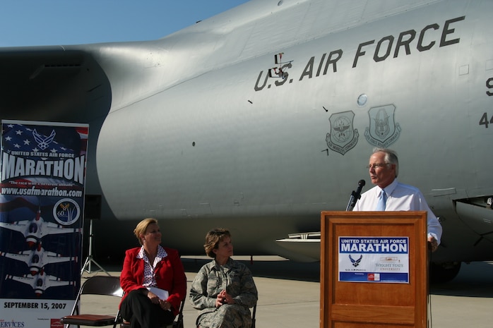 Leadership from both the Air Force and Wright State University gather at a press conference June 13 to discuss their new USAF Marathon partnership, and other details of the September race. On the flightline of the 445th Airlift Wing in front of a massive C-5 Galaxy -- the featured aircraft of the 11th annual race --  are Lt. Gen. Terry Gabreski, vice commander of Air Force Materiel Command, Molly Louden, director of the USAF Marathon, and David R. Hopkins, president of Wright State University, who all took turns speaking to nearly two dozen media members. (Air Force photo by Kathleen A.K. Lopez)

