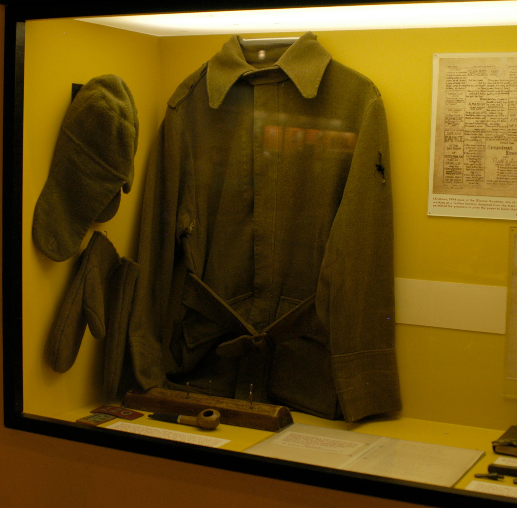 DAYTON, Ohio - POW-made jacket, cap and gloves on display in the World War II Gallery at the National Museum of the U.S. Air Force. (U.S. Air Force photo)