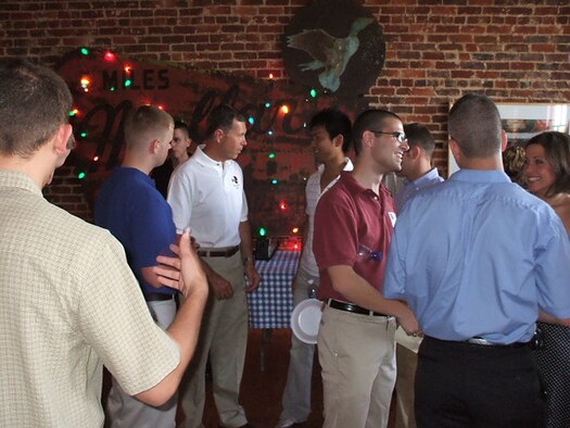 Lt. General William Fraser, Assistant to the Chief of the Joint Chiefs of Staff mingles with student pilots during the Pilot Partner Welcome event co-hosted by the Air Force Association and the Columbus Lowndes Development Link.  The event was held at the Birney Imes Art Loft in downtown Columbus.