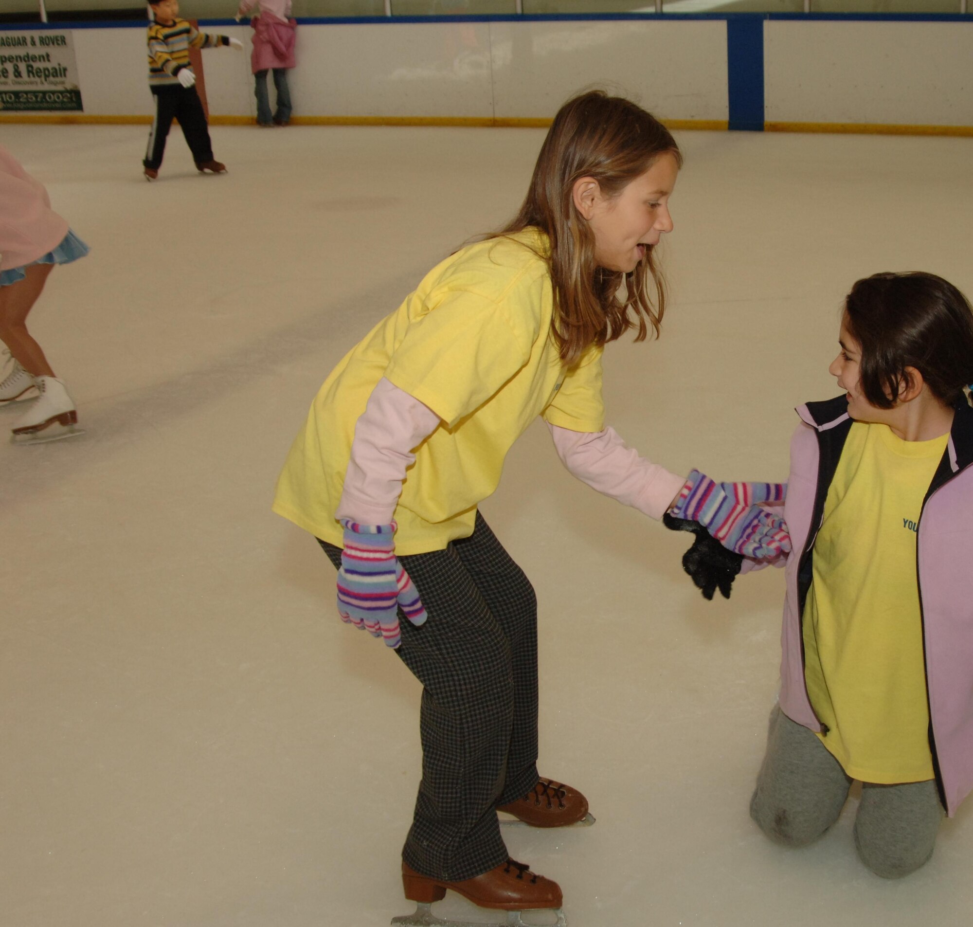 On a youth program trip to a local skating rink, a family member lends a hand to her friend. This summer’s camp program includes field trips to Mulligan's Family Fun Center, Mud Park in Huntington Beach, Natural History Museum and the Science Museum.  In addition to the trips, campers will be able to participate in activities such as art projects, science projects, team-building projects, swimming, writing, singing, community service and Fit Factor/sports participation. The summer camp begins June 25.