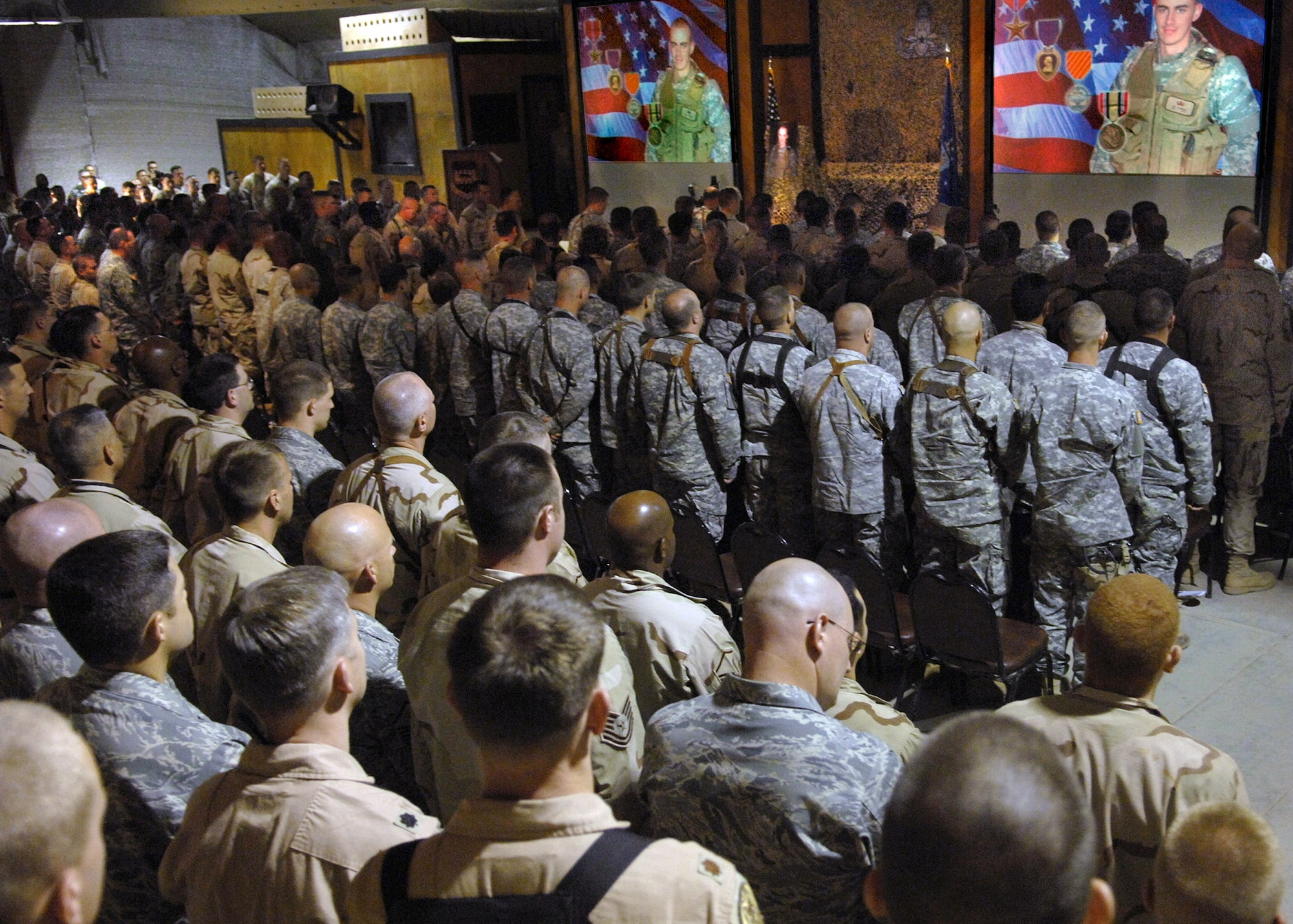 Members of Balad Air Base, Iraq, and Anaconda Base gather for the memorial service for Senior Airman William N. Newman June 10. (U.S. Air Force photo/Tech. Sgt. Alan Port) 
