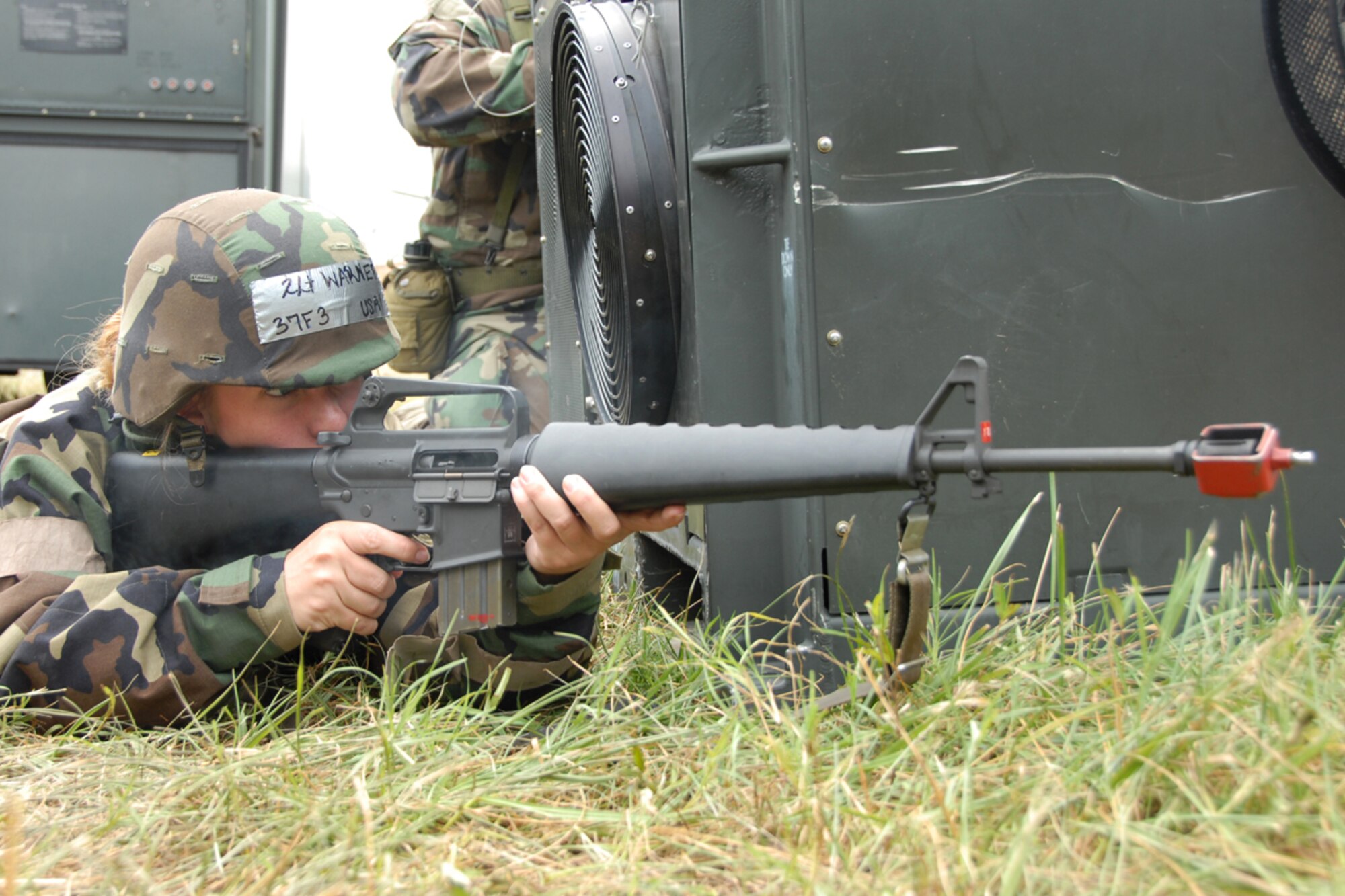 Second Lt. Seana Warner, a 189th Mission Support Flight personnel officer, helps defend the base during an attack during the Guard's weekend exercise. (Photo by Senior Airman Julain Johnson)