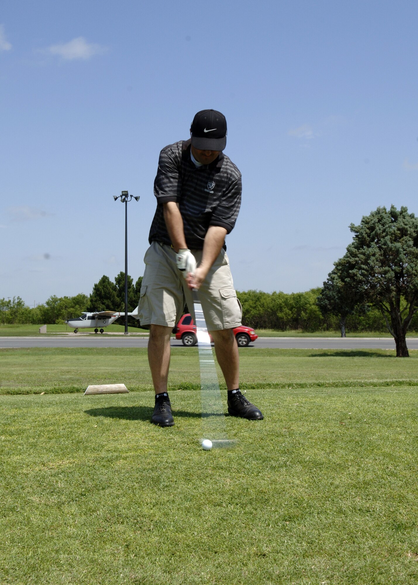 DYESS AIR FORCE BASE, Texas -- Master Sgt. AJ Oldfather, 7th Civil Engineer Squadron, drives on the 17th hole during a 9th Bomb Squadron golf tournament June 1. 132 Dyess people played, and the tournament raised $2,000 for the Big Brother and Big Sisters Organization in Abilene. (U.S. Air Force photo/Airman Stephen Reyes