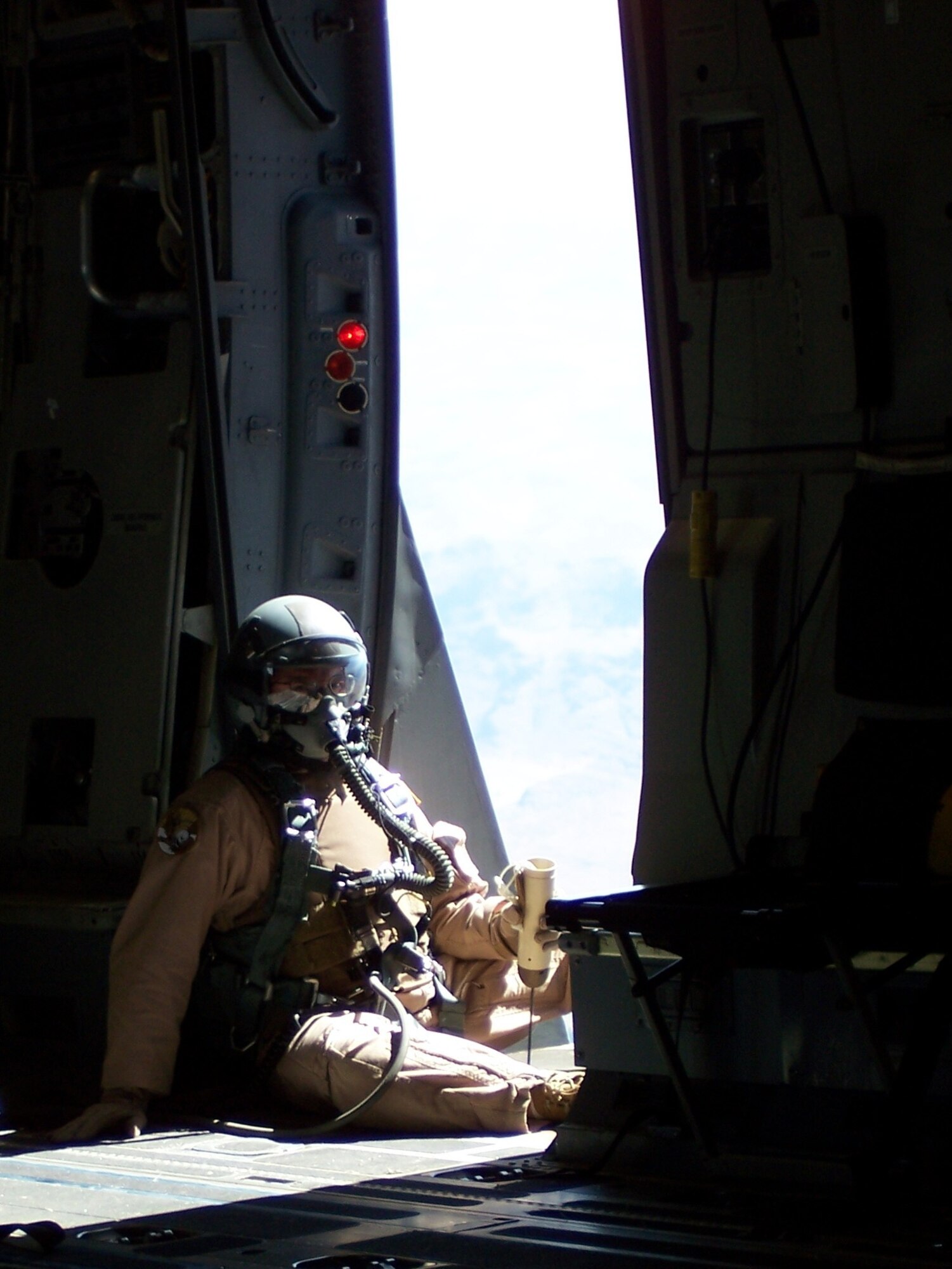 Master Sgt. David Becker, 816th Expeditionary Airlift Squadron chief loadmaster, prepares for their approach over the designated drop zone prior to the C-17s first-ever JPAD “screamer” airdrop.  