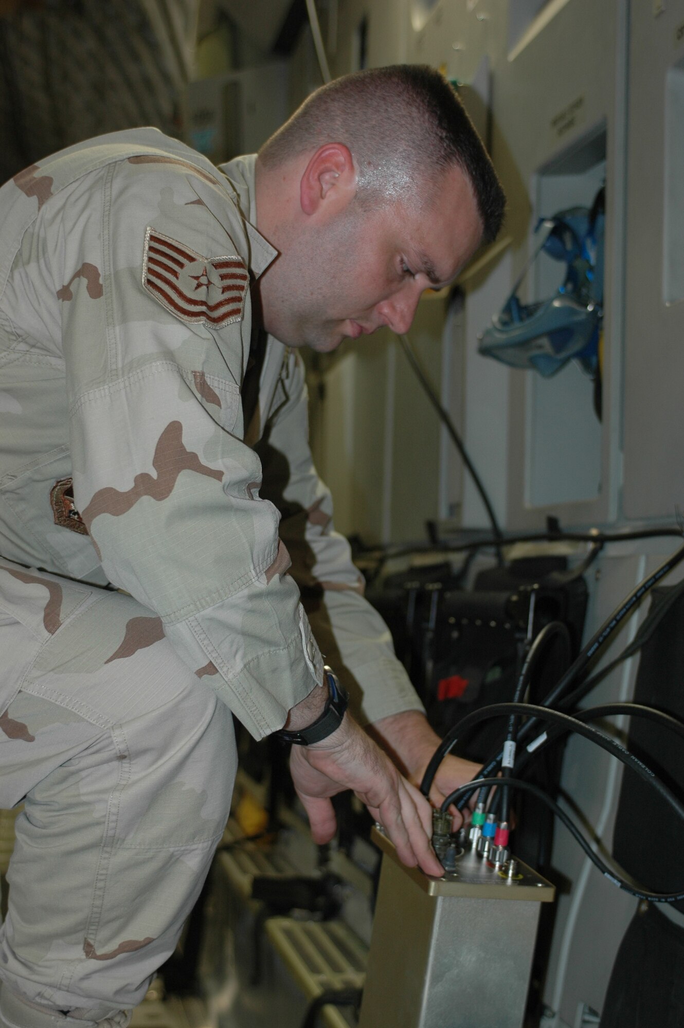 Tech. Sgt. Jonathon Welsh, 8th Expeditionary Air Mobility Squadron communication navigation mission systems specialist, loads the Joint Precision Airdrop System onto a C-17 Globemaster III prior to an airdrop mission. Sergeant Welsh is responsible for loading JPADS onto airlift assets and conducting systems checks.