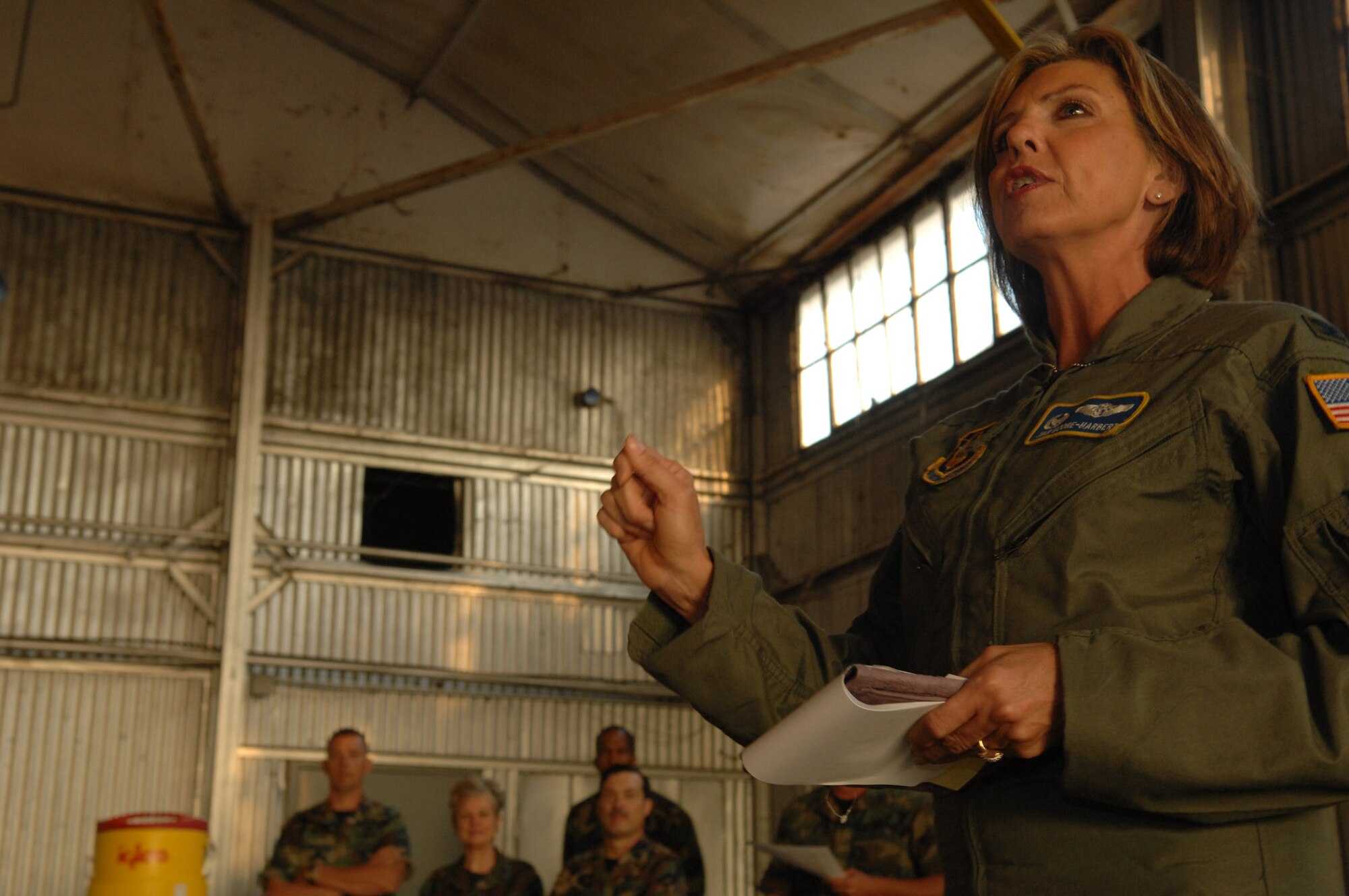 U.S. Air Force Colonel Janet Moore-Harbert, 706th Provisional Wing Commander, Fort Gordon Army Base, GA, briefs hundreds of medical personnel regarding their upcoming training in Hangar 1 at Augusta Regional Airport during Golden Medic 2007. Golden Medic is a yearly medical exercise sponsored by the U.S. Army designed to provide a realistic training experience to participating combat support and service support units, while enhancing the overall training and readiness of Army and Air Force medical units. (U.S. Air Force photo by Senior Airman Erica J.Knight)(RELEASED)