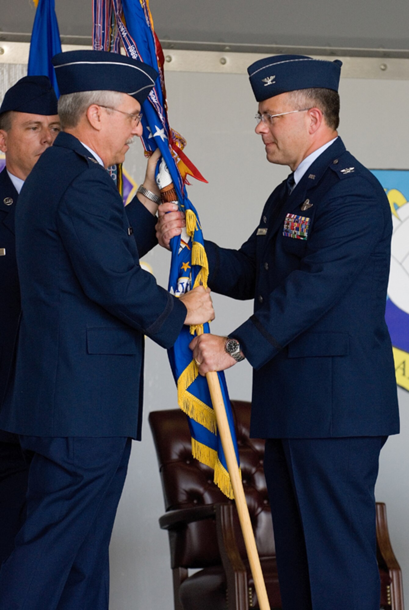 DOVER AIR FORCE BASE, Del. -- Col. Randal. L. Bright assumes command of the Air Force Reserve's 512th Airlift Wing during a ceremony June 9 in Hangar 945 here. The officiating officer was Maj. Gen. Martin M. Mazick, commander, 22nd Air Force.  Colonel Bright replaces Col. Ronald A. Rutland, who has moved to a position with 22nd Air Force. (U.S. Air Force photo/Roland Balik)