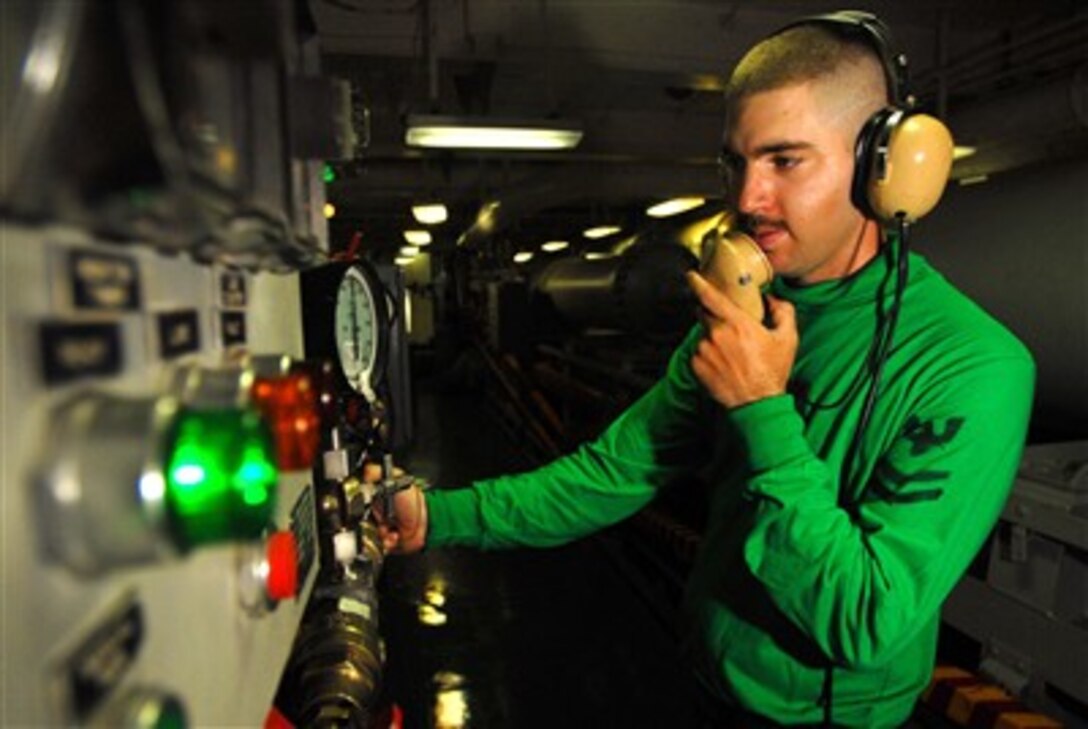Navy Petty Officer 2nd Class Joseph Mikes charges an arresting gear engine to the correct pressure to recover an aircraft aboard the aircraft carrier USS John C. Stennis (CVN 74) during flight operations on May 29, 2007.  Arresting gear engines are charged with specific pressures to recover multiple types of aircraft during flight operations.  The John C. Stennis Carrier Strike Group is conducting operations in the Persian Gulf.  