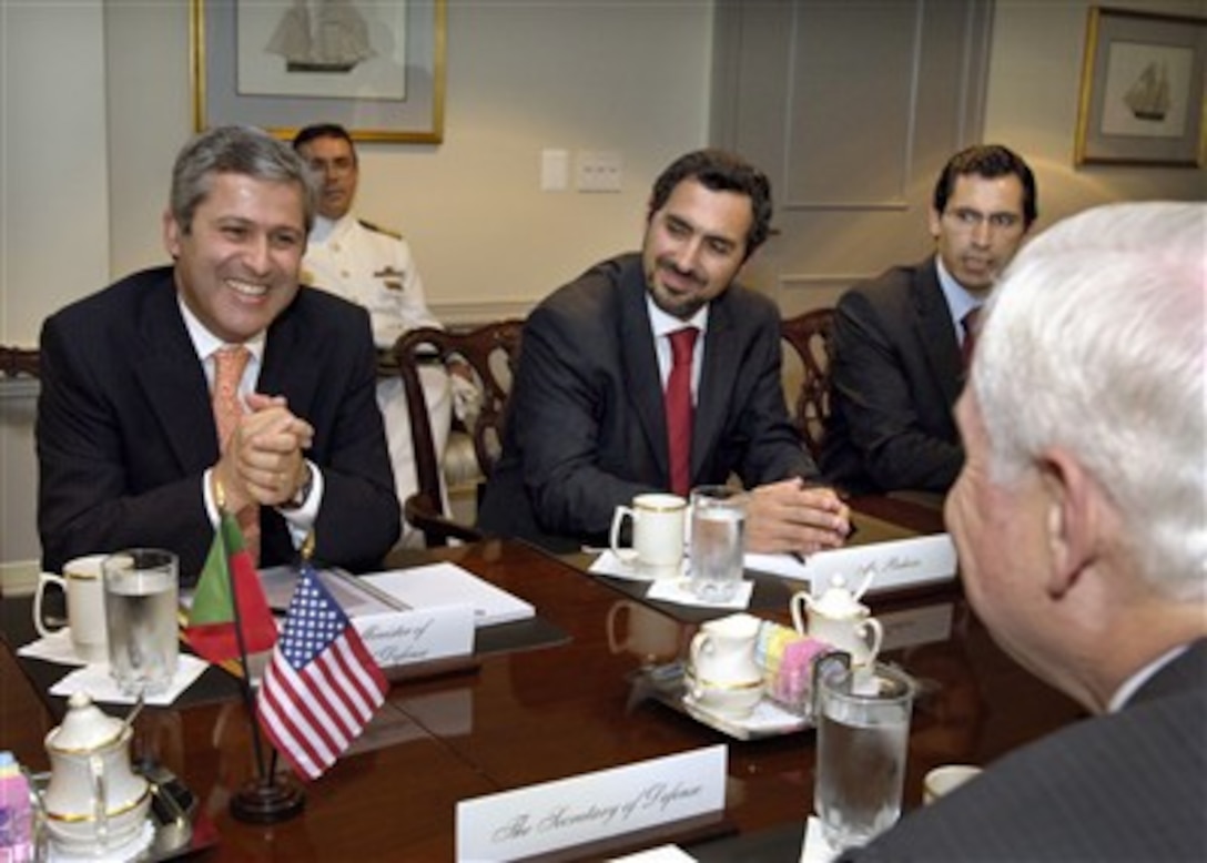 Portuguese Minister of Defense Nuno Severiano Teixeira (left) meets with Secretary of Defense Robert M. Gates (right) to discuss a range of bilateral security issues in the Pentagon on June 8, 2007.  Joining Teixeira are Director General for National Defense Policy Paulo Vizeu Pinheiro (center) and Diplomatic Advisor to the Minister Joao Paulo Costa (right).  