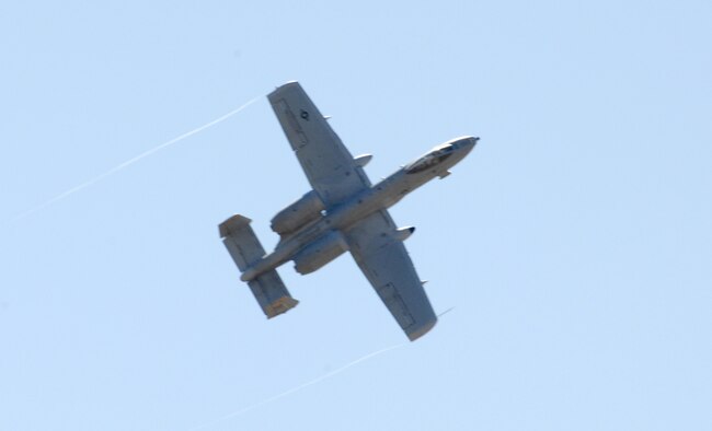 A D-M A-10 flies away from the target area after a bombing pass during the Pioneer Air Festival competition held June 8 at Cannon Air Force Base. Six D-M aircraft participated -- representing all three fighter squadrons here -- and three took first place in at least one area. (U.S. Air Force photo/Airman 1st Class Randi Flaugh)