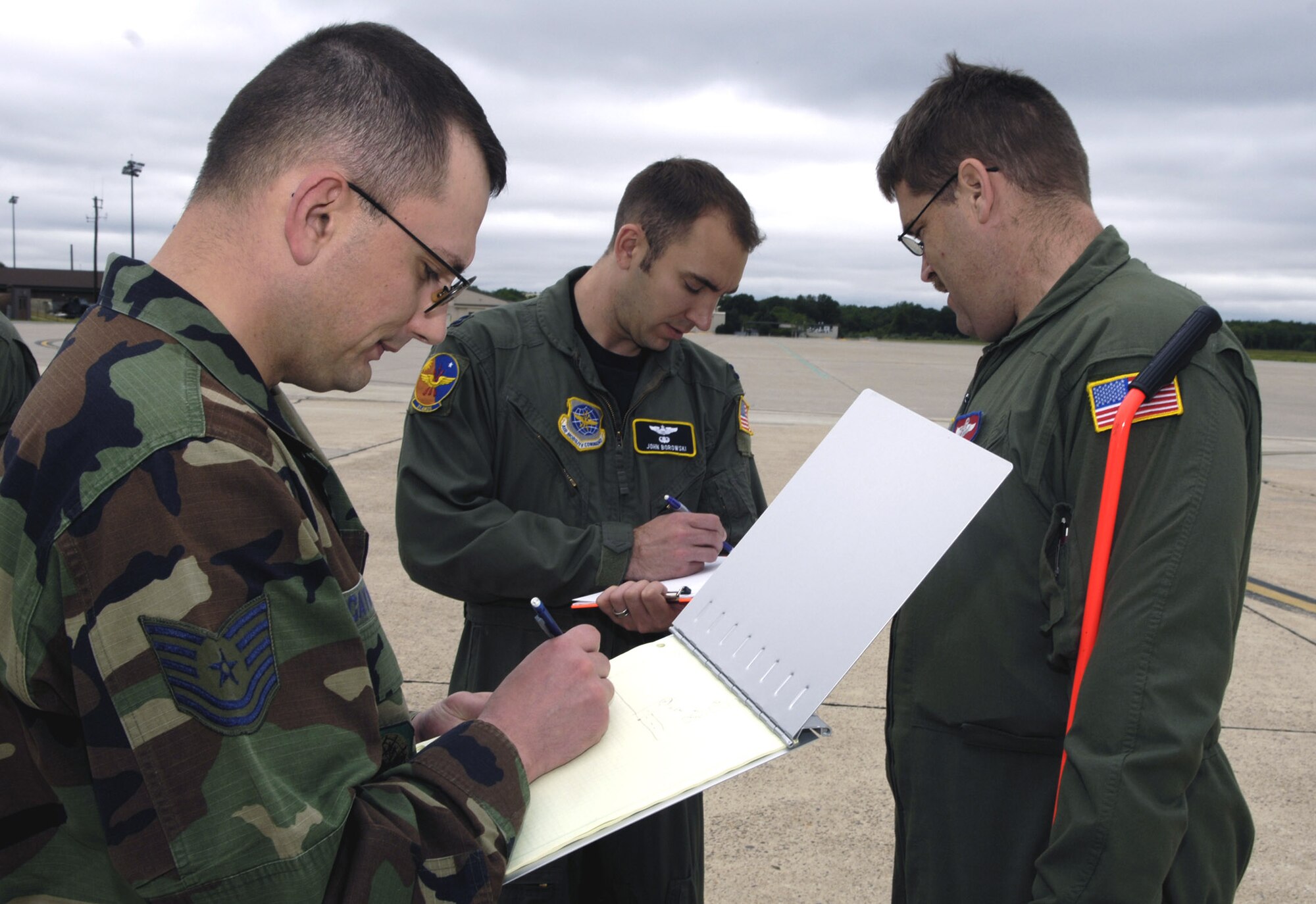 Students in the Mobility Air Forces Mobile Command and Control Leadership Course record information on the flightline at McGuire Air Force Base, N.J., during an airfield survey exercise June 4.  (U.S. Air Force photo/Ken Mann) 