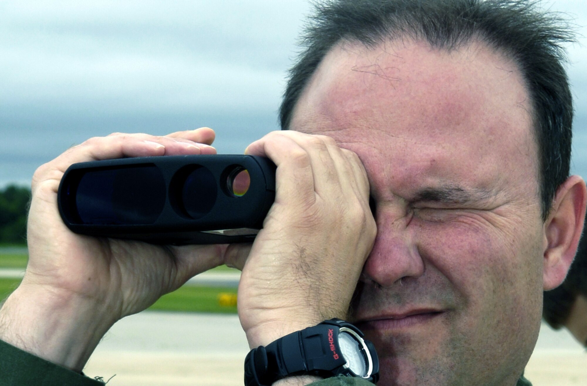 Senior Master Sgt. Robert Finney uses a laser distance measuring device on the flightline at McGuire Air Force Base, N.J., during an airfield survey exercise June 4 for the Mobility Air Forces Mobile Command and Control Leadership Course.  Sergeant Finney is with the Mississippi Air National Guard.  (U.S. Air Force photo/Ken Mann) 