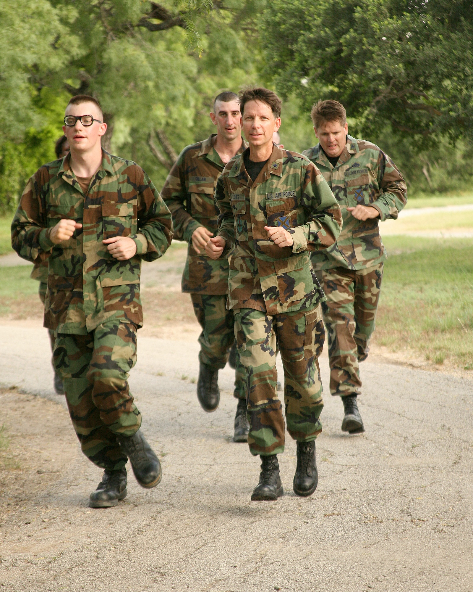 Brig. Gen. Darrell Jones, a former 37th Training Wing commander at Lackland Air Force Base, Texas, runs the basic military training obstacle course with basic trainees June 11, 2007. (USAF photo by  Robbin Cresswell)