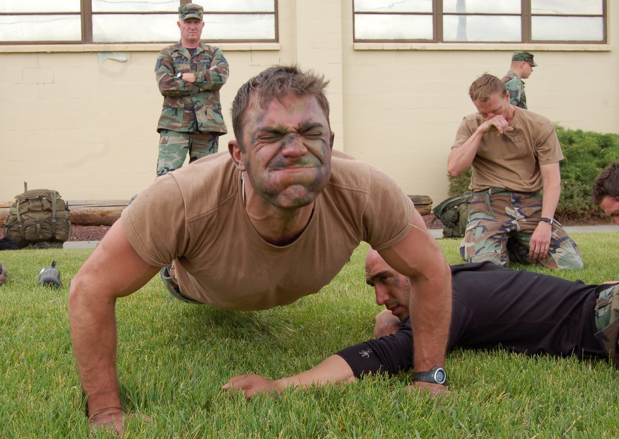 FAIRCHILD AIR FORCE BASE, Wash. -- Staff Sgt. Matthew Zimmer, Survival, Evasion, Resistance, and Escape specialist and water survival instructor, works to pump out as many push-ups as possible during the SERE Challenge June 13. Physical fitness was one event the participants competed in. The challenge was open to all Guardian Angel Weapon System personnel, which includes SERE specialists, combat rescue officers and pararescuemen. (U.S. Air Force photo/Staff Sgt. Matthew Rosine)