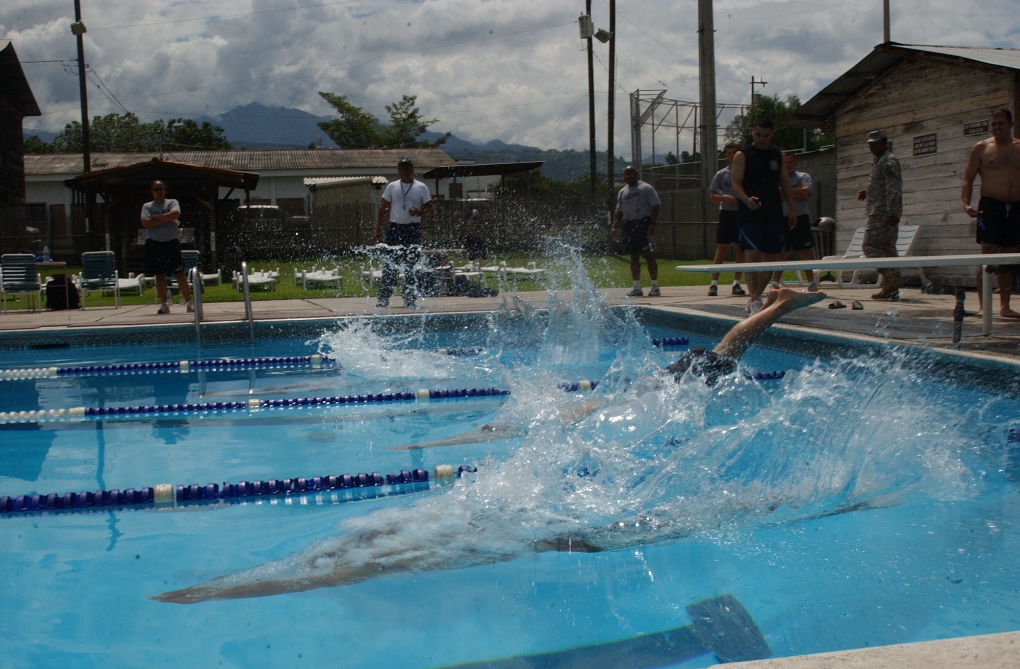 Competitiors dive in to the base pool during the swimming competition at JTF-Bravo Sports Day June 13. JTF-Bravo sports day pitted athletes from Soto Cano Air Base against their Honduran military counterparts in six events; soccer, swimming, basketball, softball, volleyball and a 4x400-meter relay race. U.S. Air Force photo by Senior Airman Shaun Emery.