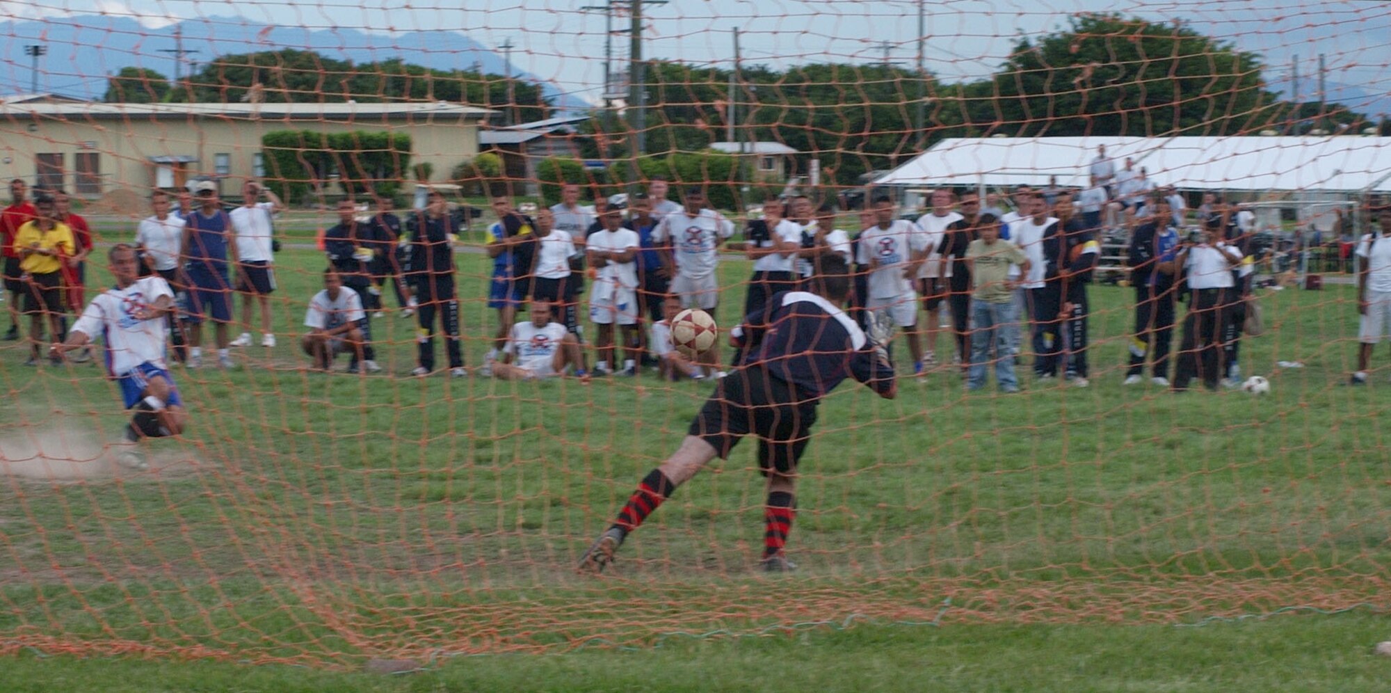 Joint Task Force-Bravo goalie, Bryan Hoover, makes diving save during a shootout between JTF-Bravo and the Honduran Air Force at JTF-B Sports Day June 13. JTF-Bravo sports day pitted athletes from Soto Cano Air Base against their Honduran military counterparts in six events; soccer, swimming, basketball, softball, volleyball and a 4x400-meter relay race. U.S. Air Force photo by Senior Airman Shaun Emery.