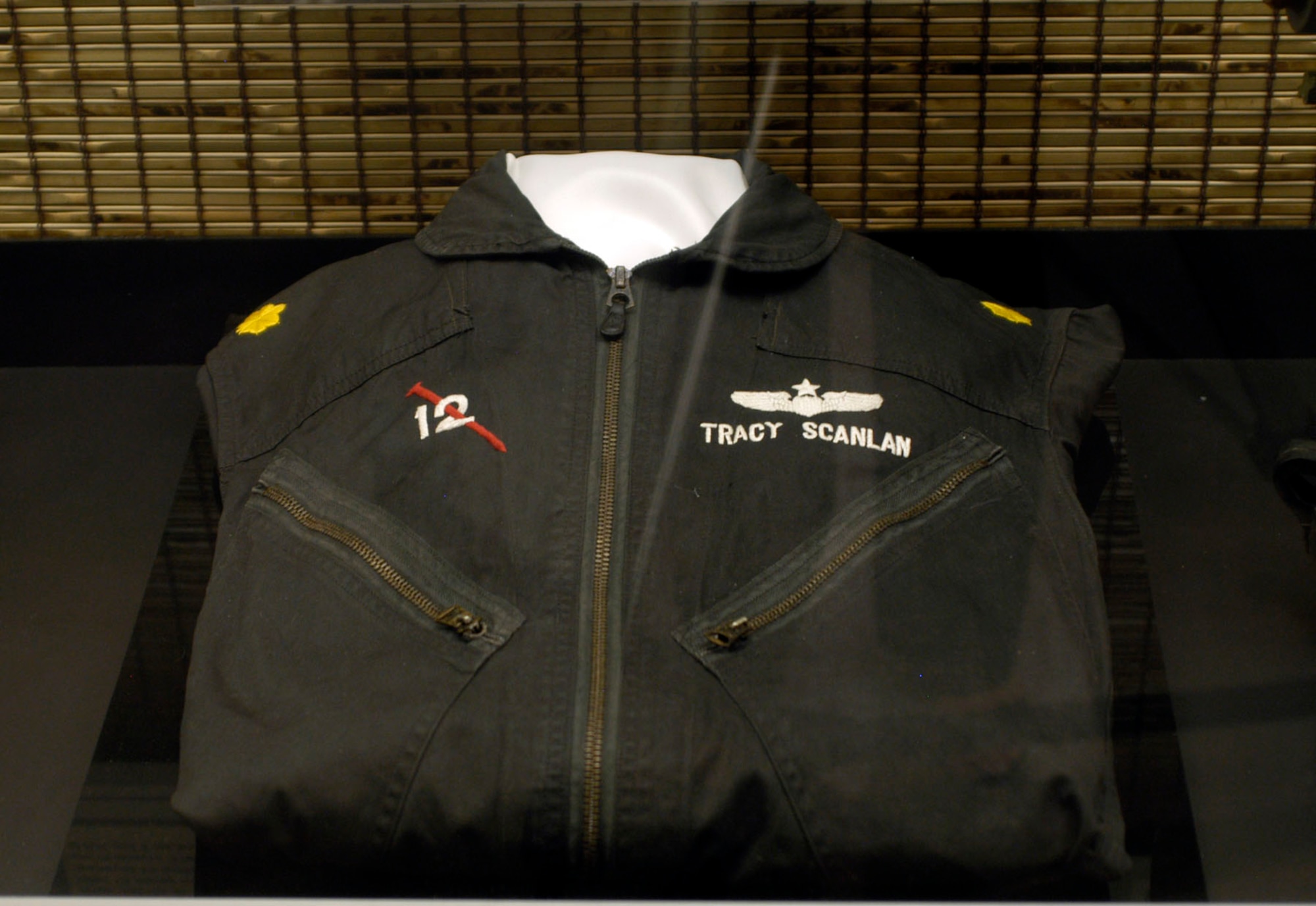 DAYTON, Ohio - Black flying coveralls worn by Maj. Tracy A. Scanlan (later Lt. Col.) on night FAC missions along the Ho Chi Minh Trail in 1968. Flying an O-2 with the 23rd TASS, he normally would not have worn the bright major’s insignia on night missions. This uniform is on display in the Southeast Asia War Gallery at the National Museum of the U.S. Air Force. (U.S. Air Force photo)