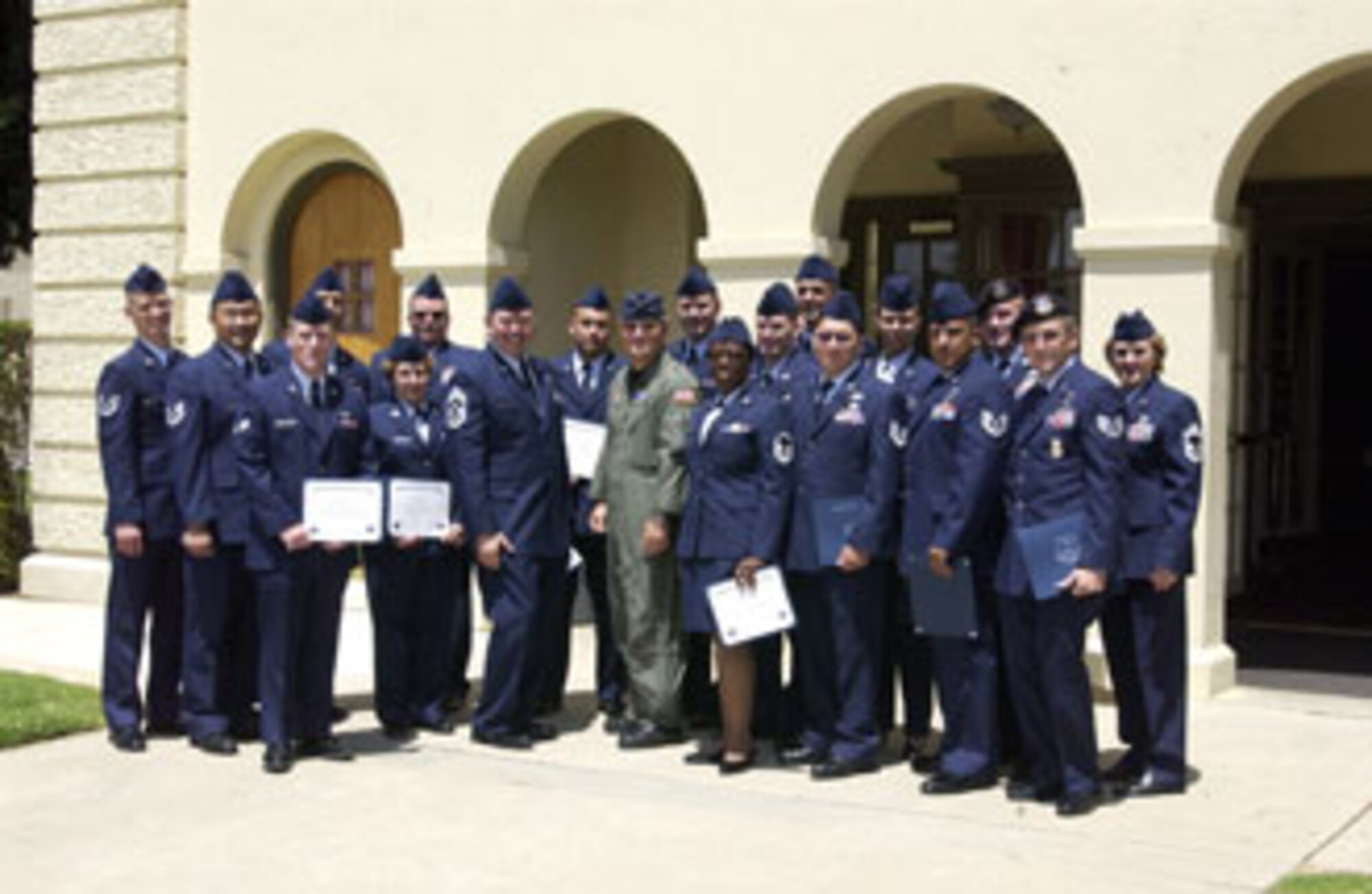 The 452nd Air Mobility Wing Command Chief Agustin Huerta (left center), Commander Brig. Gen. James Melin (right center) and Chief of Education and Training Chief Master Sgt. Roberta Lewis (far right), celebrated a “job well done” as 16 wing members received certificates of graduation from the Community College of the Air Force. The graduates were: Senior Master Sgt. John Thomas; Master Sgts Garold Cole, Jesse Hagen, Robert Healey, Francis Nesbitt and Lisa Turiano; Tech. Sgts Troy Castro, Robert Newton II, Raul Quintero, Sunny Saelee and Michael Stefanovich; Staff Sgts John Brown, Jr, Ryan Slanina, Aja Smith and Stanley St John;
Senior Airman Matthew Carlton. (U.S. Air Force photo by Amy Abbott)