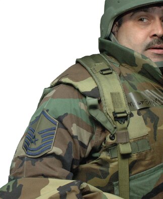 KEESLER AIR FORCE BASE, Miss. -- A flack vest and Kevlar helmet become everyday wear for troops deploying in support of U.S. contingencies. Master Sgt. Alan Bourgeois, 403rd Maintenance Squadron, and others from the 403rd Wing got a taste of wearing the gear as they processed and prepared for transportation to Volk Field, Wis. for training.  Airmen from the 403rd Wing and 433rd Airlift Wing spent a week in Wisconsin training on Ability to Survive and Operate procedures.(U.S. Air Force Photo/Senior Airman Tabitha Spinks)