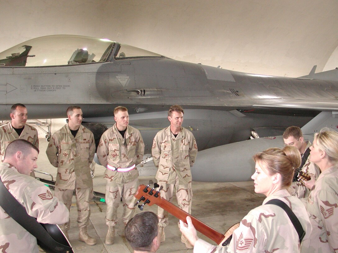 Night Wing, part of the USAF Heartland of America Band, give Airmen a musical break on a flight line in Iraq