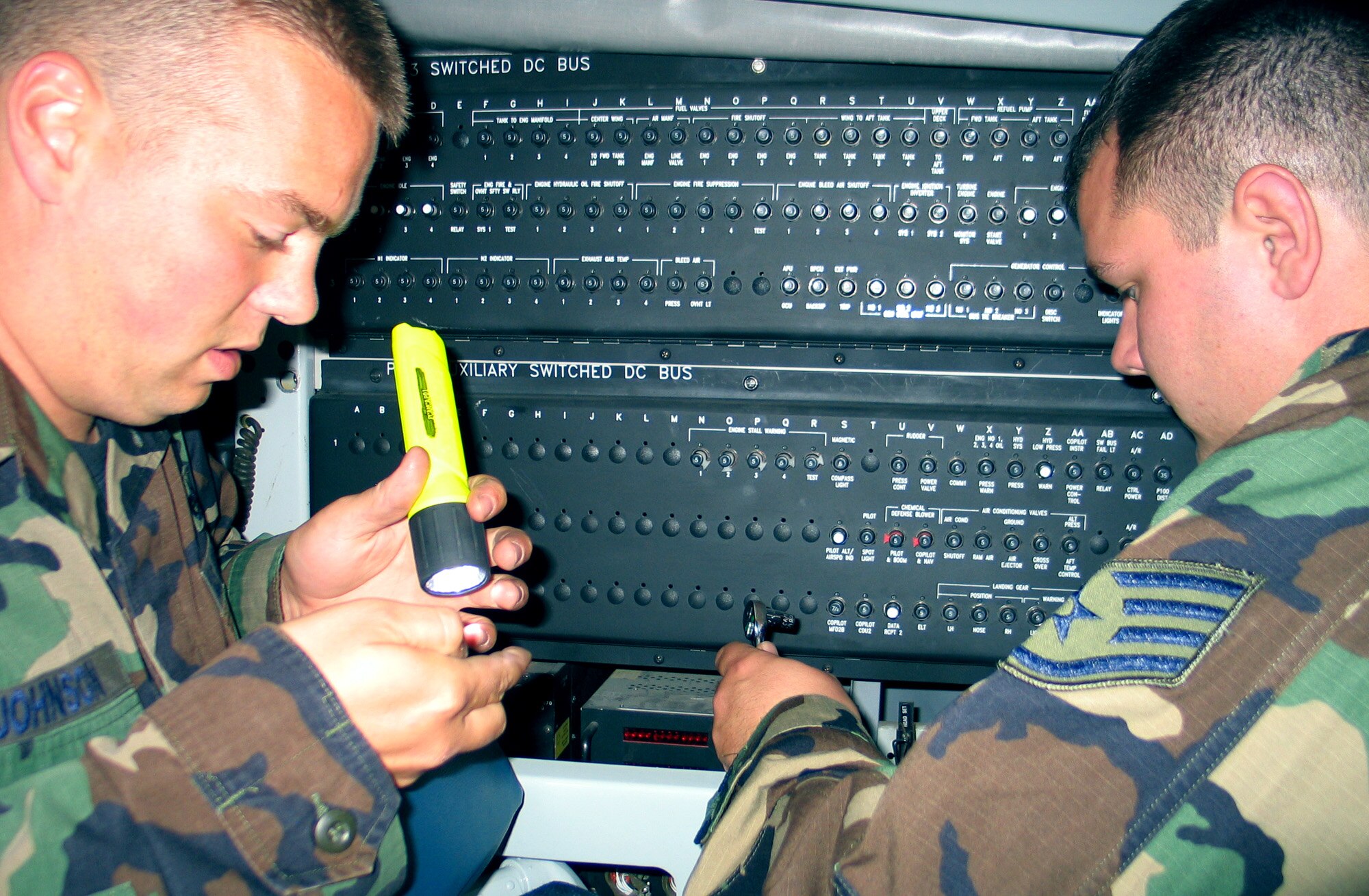 FAIRCHILD AIR FORCE BAS, Wash. – Staff Sgt. Jordan Johnson (left), 92nd Aircraft Maintenance Squadron instruments and flight control systems specialist, and Staff Sgt. Peter Branch, 92nd AMXS navigation systems specialist, install an interfoam board on a KC-135 forward boom station. The board allows aircrew to speak to the entire aircraft. The sergeants are helping to prepare the aircraft for the upcoming Air Mobility Rodeo 2007 at the end of July. (U.S. Air Force photo/Staff Sgt. Connie L. Bias)