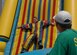 Airman 1st Class Aaron Zeichner, 83rd Communications Squadron gets caught on the "Sticky Wall" while Tim Gayner, a Ragland Production staff member watches from the sidelines during Junior Enlisted Appreciation Day here June 8. The purpose of the event was to thank Langley Airmen for their hard work and dedication. (U.S. Air Force photo/Staff Sgt. Katrina Shellman)