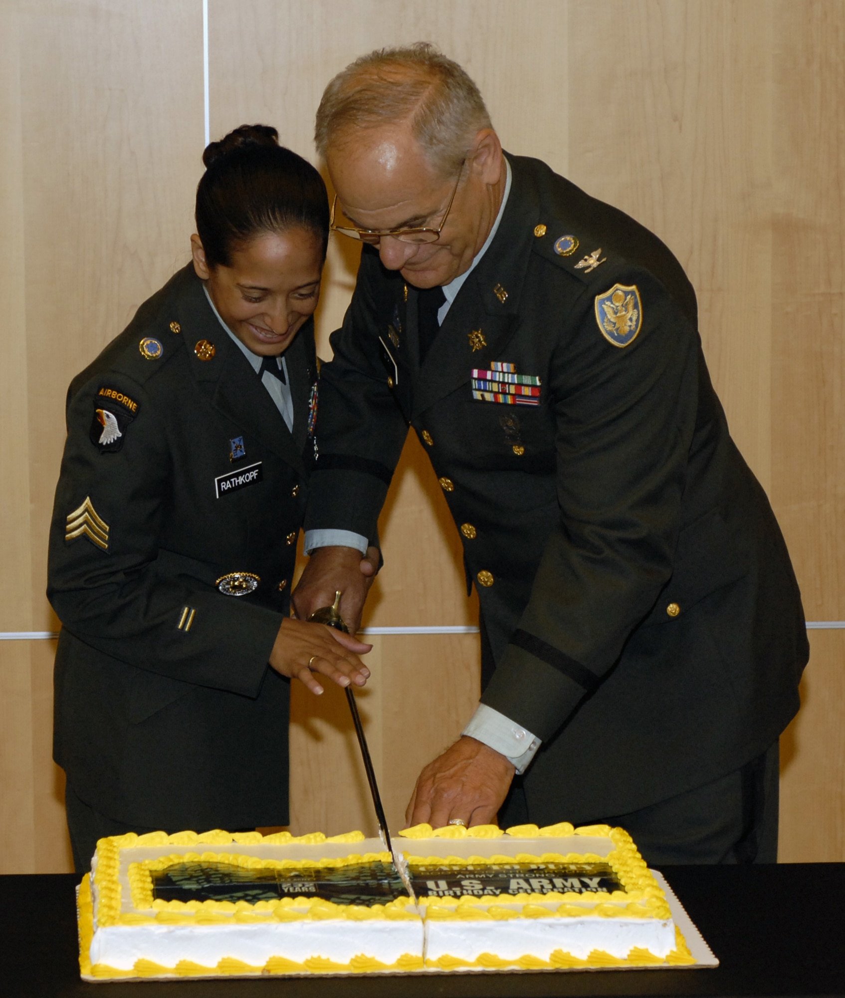 The Defense Intelligence Agency celebrated the U.S. Army’s 232nd birthday June 13 with the tradition of the most senior and junior DIA soldier making a toast and cutting the birthday cake with a ceremonial sword. Sgt. Cristin Rathkopf, left, born in 1986, and Col. Alan Witkin, right, born in 1942, did the honors. Gen. George Casey, Army chief of staff, participated in the events and was the guest speaker during DIA’s celebration on Bolling at the Defense Intelligence Analysis Center. (U.S. Air Force photo by Senior Airman Jaclyn McDonald)