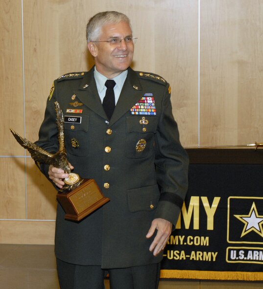 Gen. George Casey, Army chief of staff, addressed Defense Intelligence Agency personnel June 13 during their 232nd Army birthday celebration on Bolling at the Defense Intelligence Analysis Center. He was presented a token of appreciation by Lt. Gen. Michael Maples, DIA director, for supporting DIA’s celebration. The U.S. Army has been serving Americans for 232 years. “It was humbling to take over an organization that is the best in the world at what it does,” said General Casey. “The Army is as focused and committed today as I have ever seen it.” (U.S. Air Force photo by Senior Airman Jaclyn McDonald)